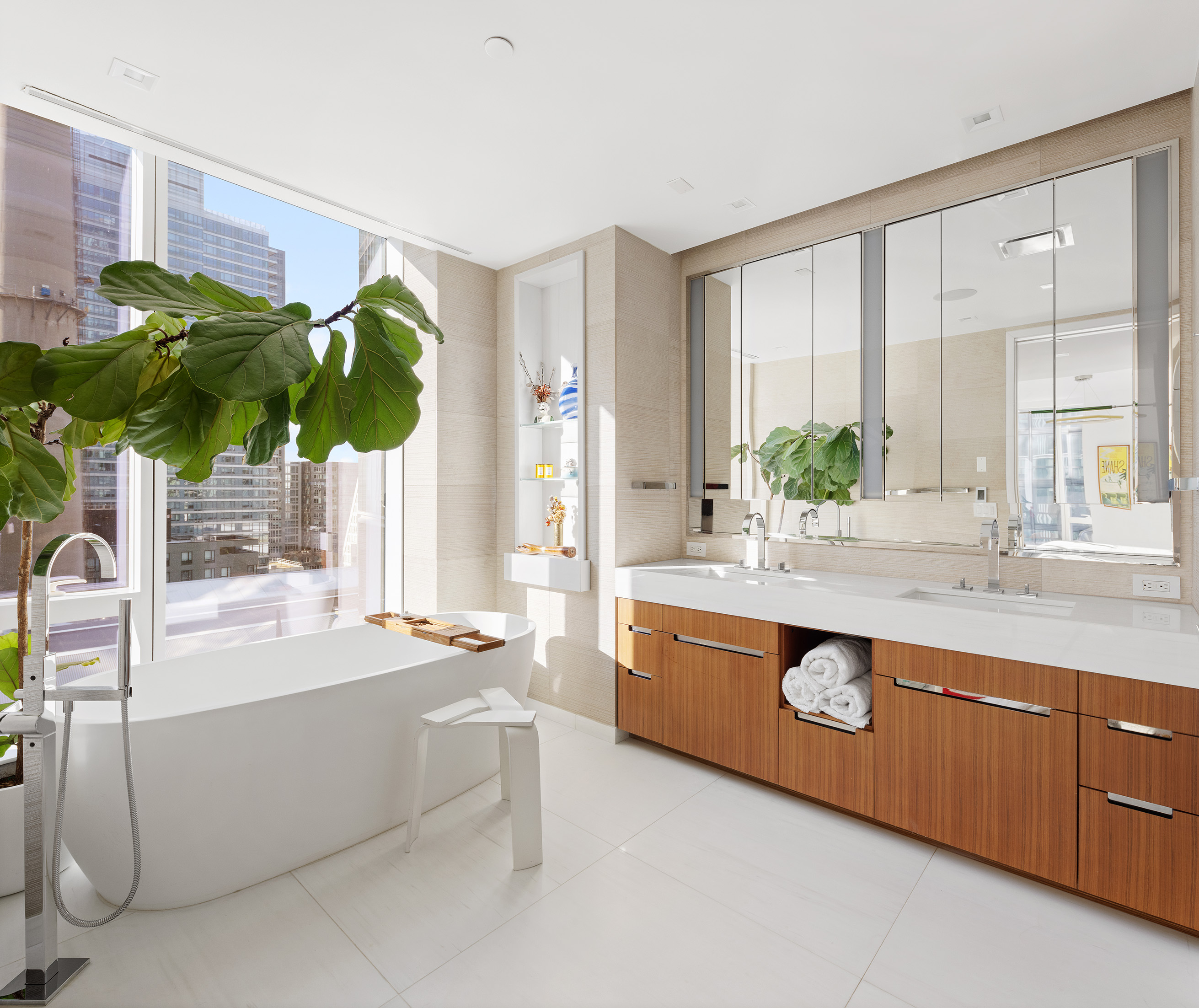 1 West End Avenue, Unit 12D Manhattan, NY 10023 - Photo 8 of 32 a bathroom with a granite countertop sink and a bathtub