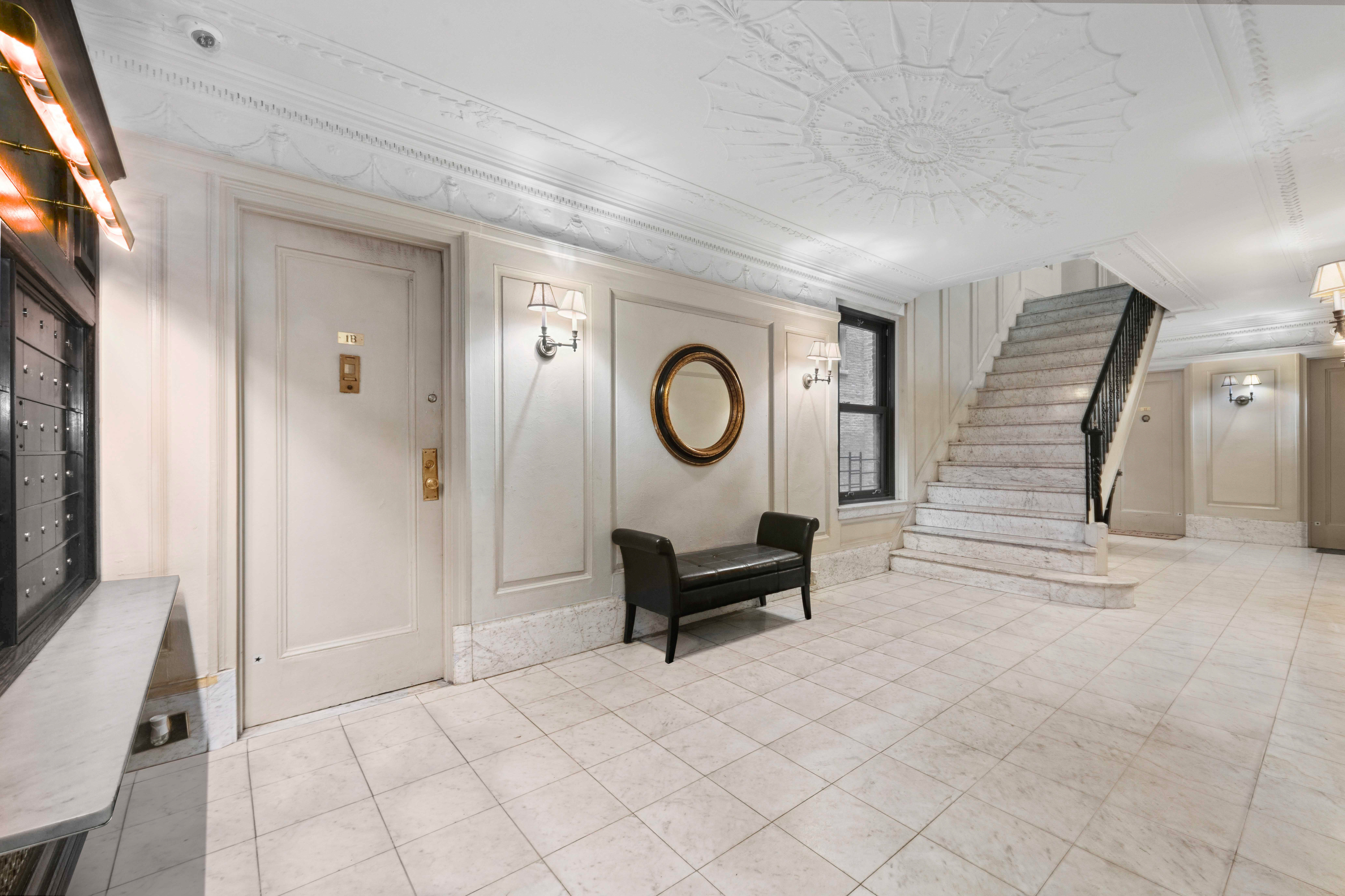 17 West 64th Street, Unit 4E Manhattan, NY 10023 - Photo 7 of 9 a living room with furniture and a window