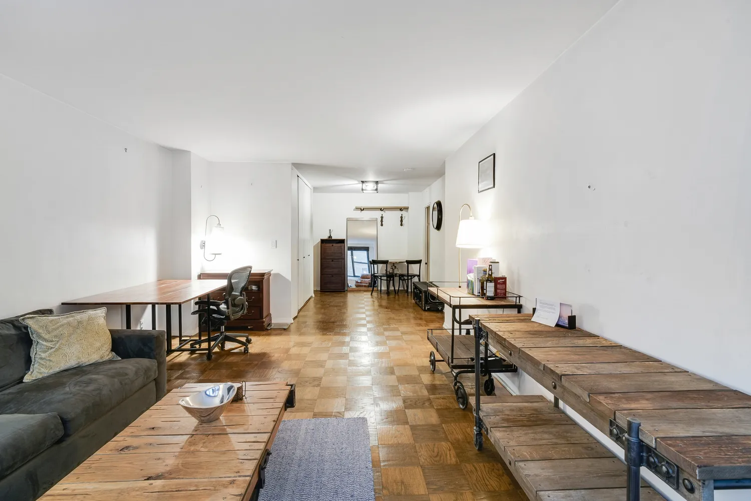 a living room with furniture and a table