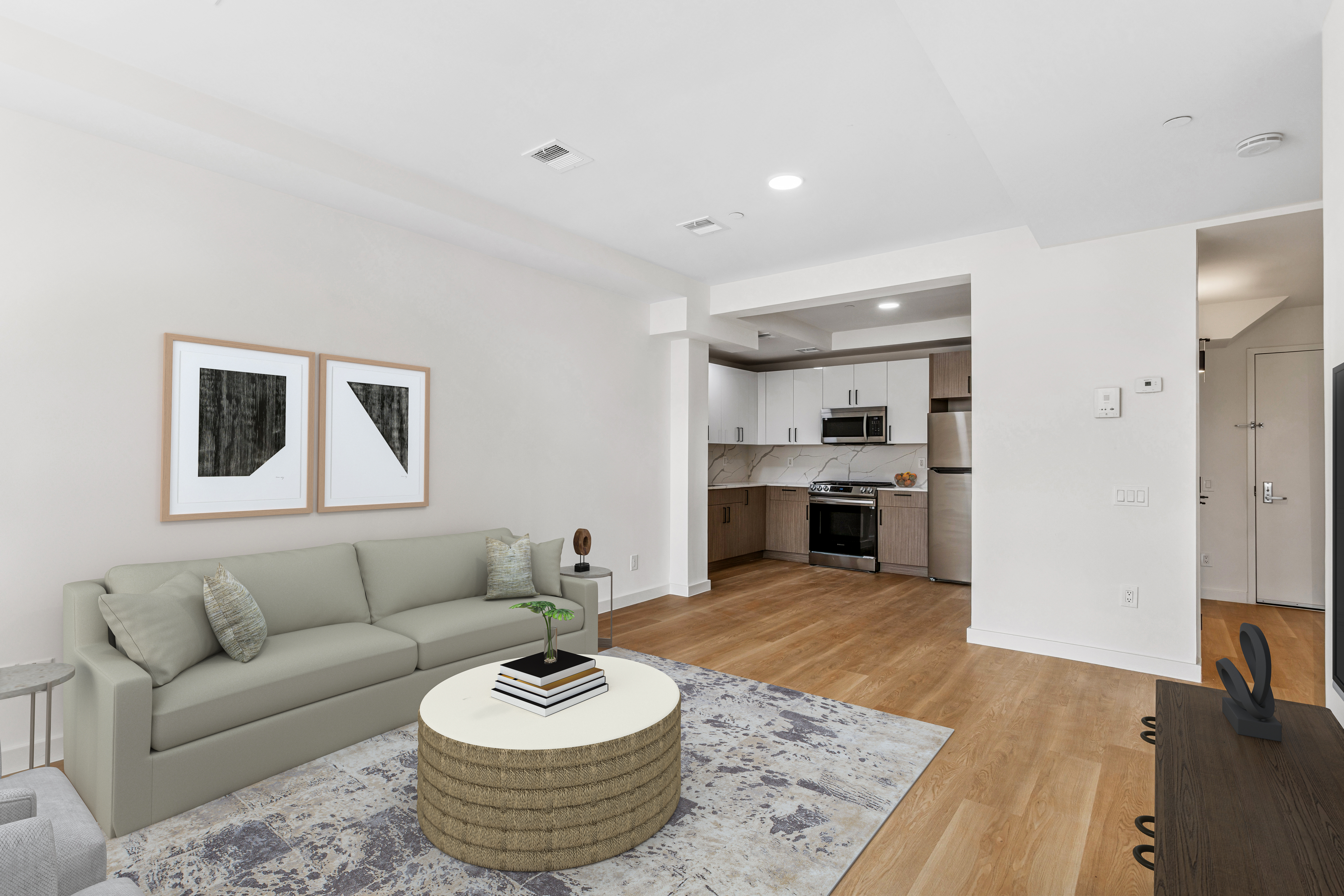3112 Emmons Avenue, Unit 205 Brooklyn, NY 11235 - Photo 2 of 9 a living room with furniture and a couch