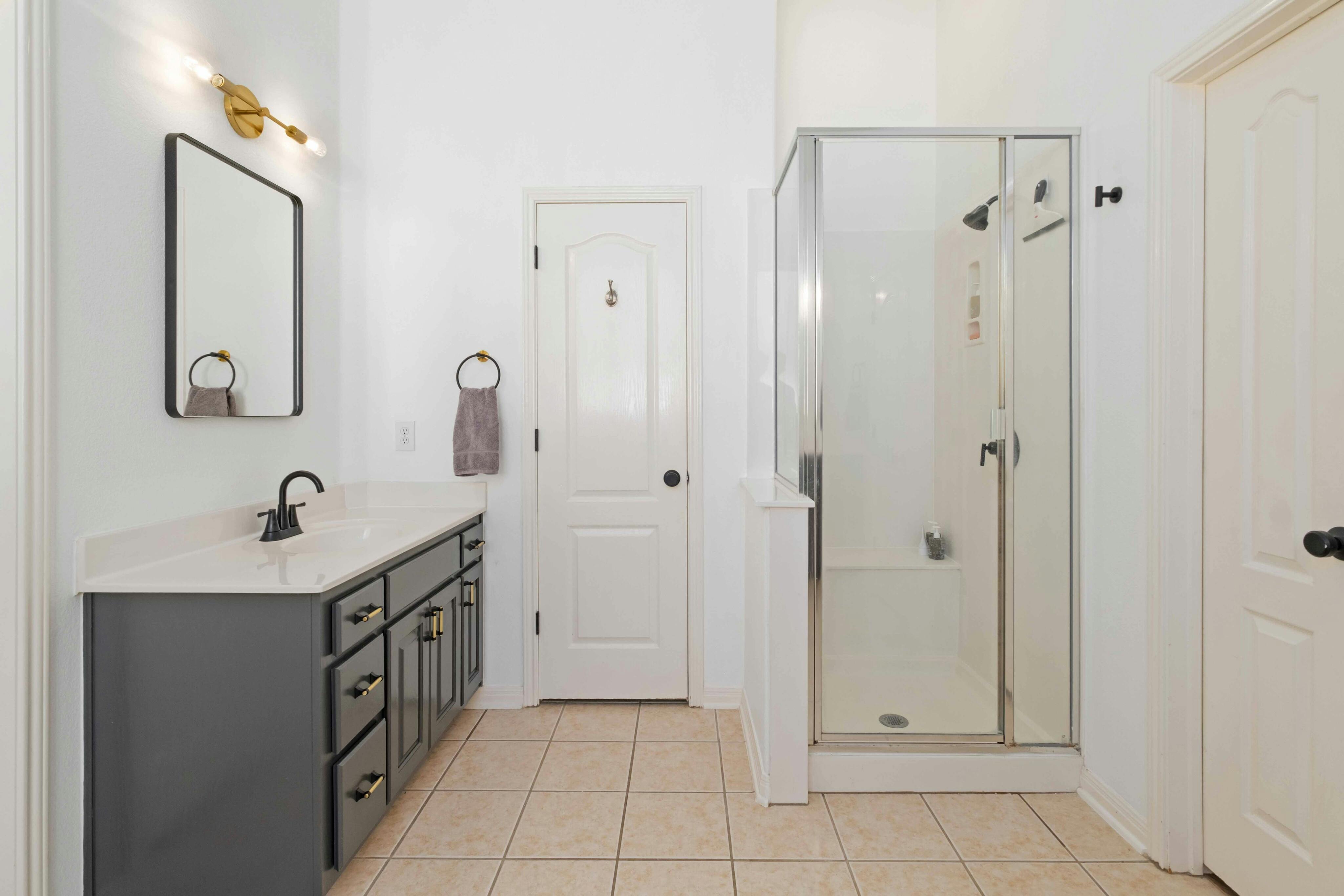 10608 Pointe View Drive Austin, TX 78738 - Photo 20 of 46 a bathroom with a sink a toilet and shower