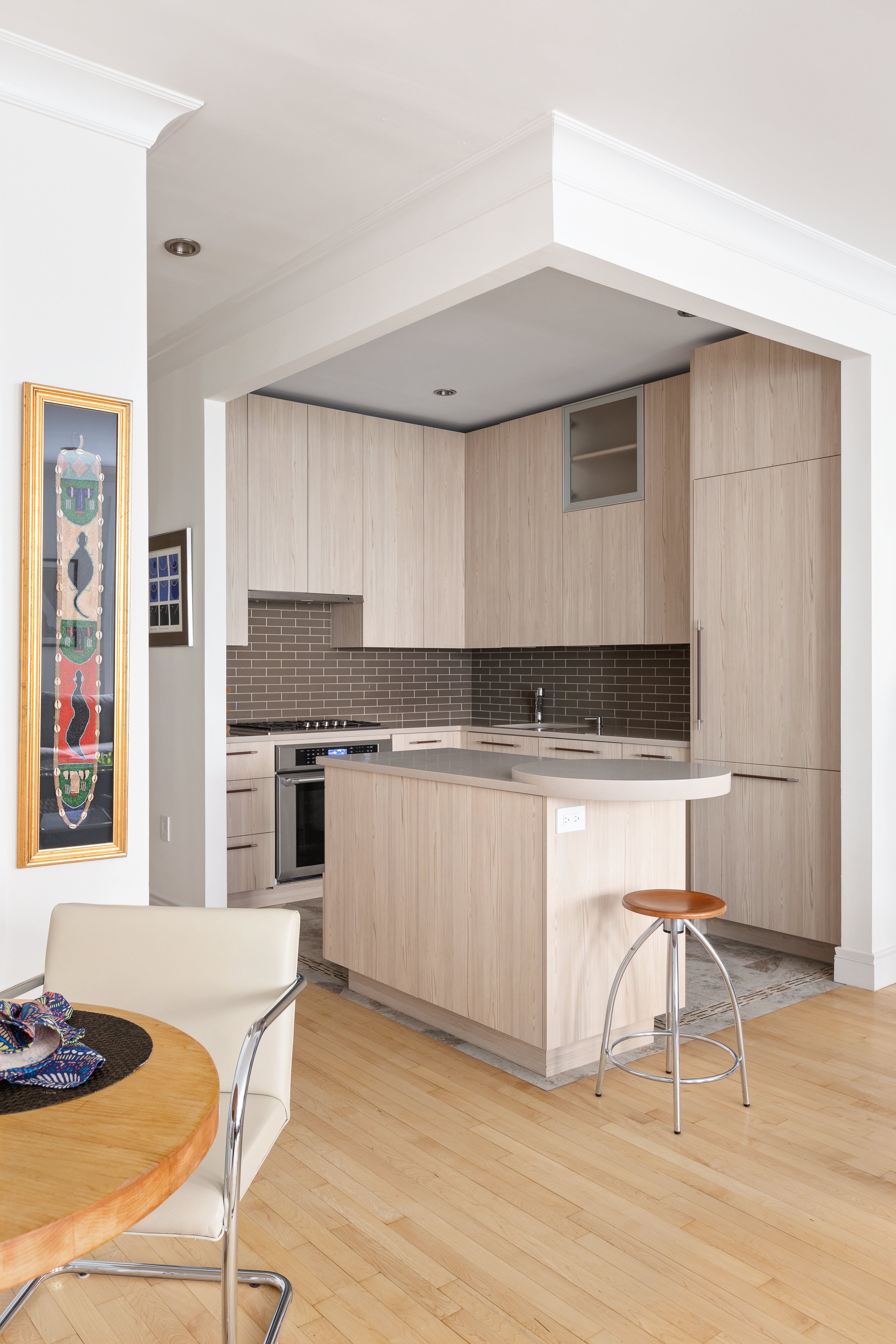 203 East 7th Street, Unit 2 Manhattan, NY 10009 - Photo 4 of 9 a kitchen with granite countertop a stove a sink and a refrigerator
