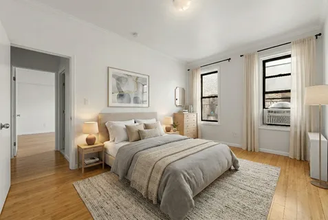 a spacious bedroom with a bed and a walk in closet