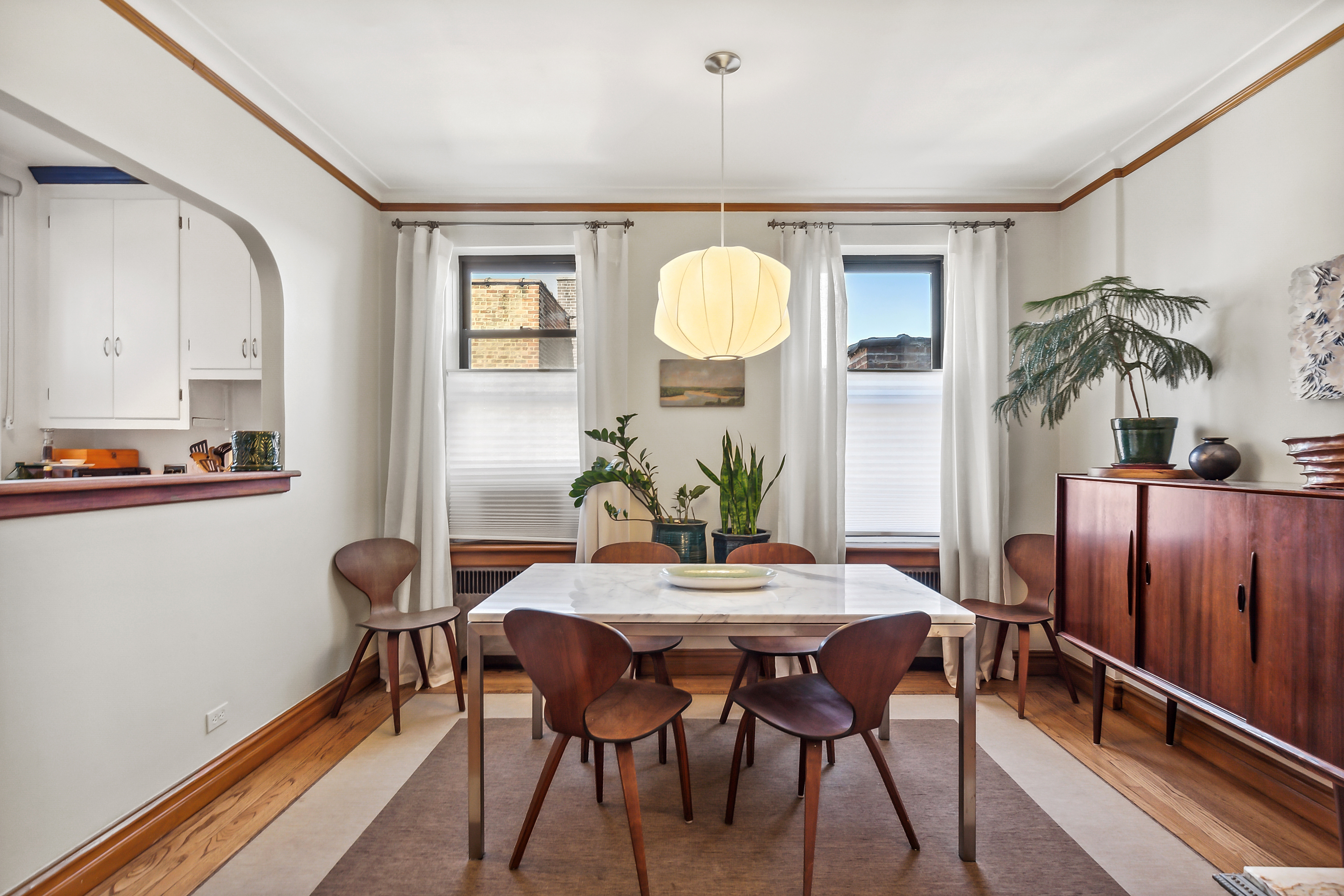 45 Park Terrace West, Unit 5A Manhattan, NY 10034 - Photo 5 of 22 a view of a dining room with furniture and wooden floor