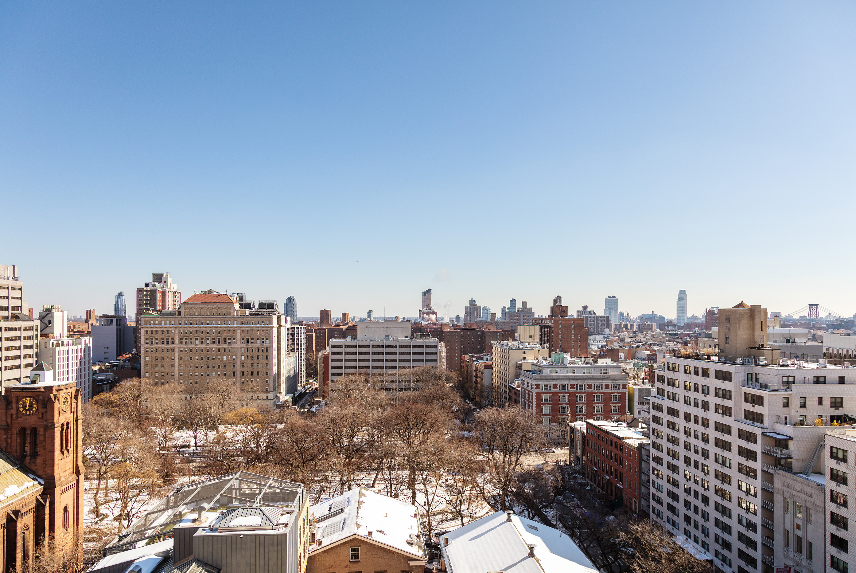 200 East 16th Street, Unit 16L Manhattan, NY 10003 - Photo 7 of 12 a view of a city with tall buildings in the background