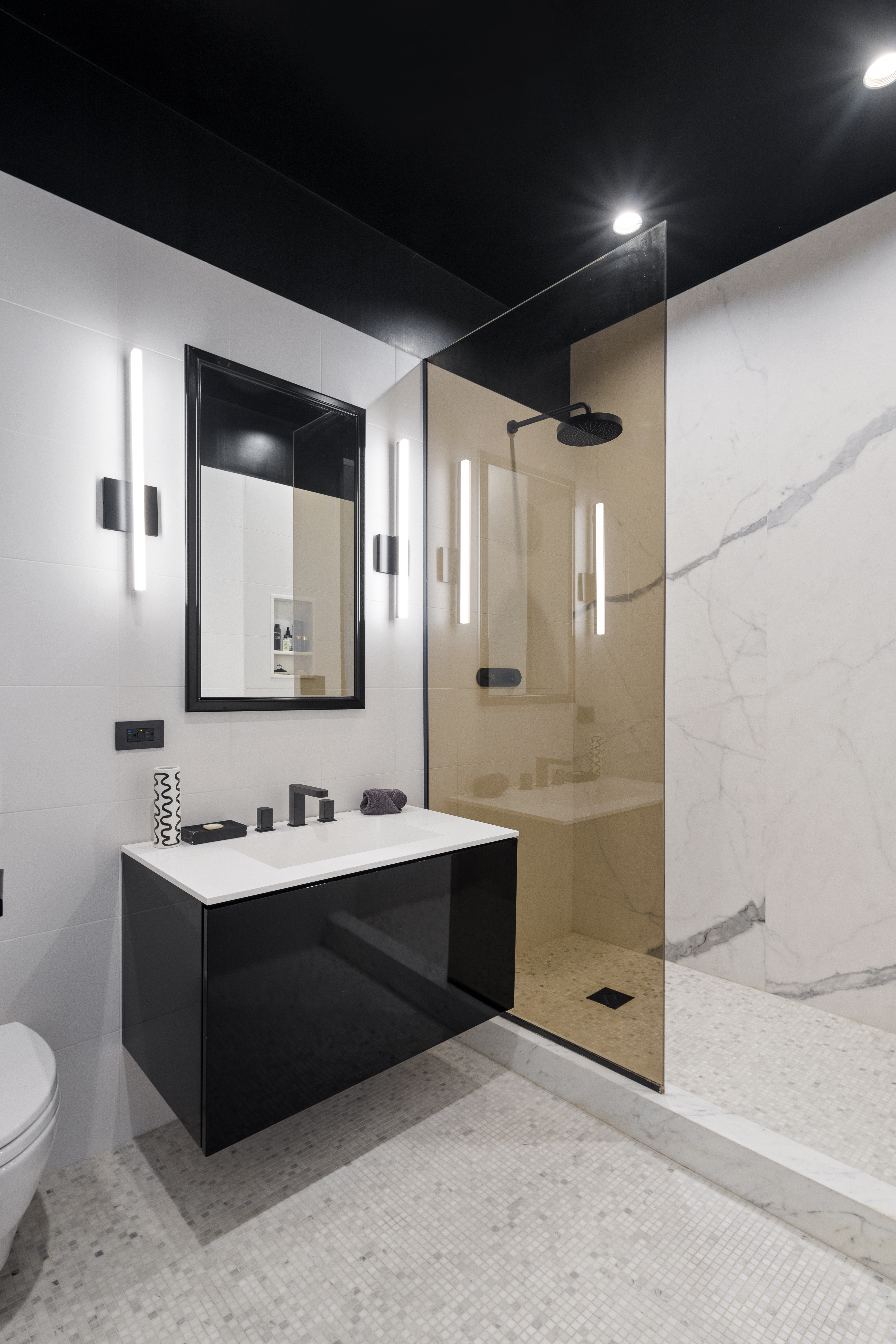 30 Crosby Street, Unit 5B Manhattan, NY 10013 - Photo 13 of 19 a bathroom with a double vanity sink toilet and mirror