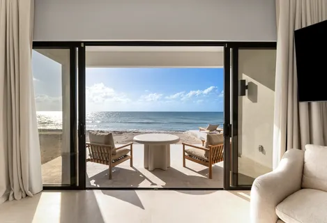 a living room with a fireplace and a flat screen tv