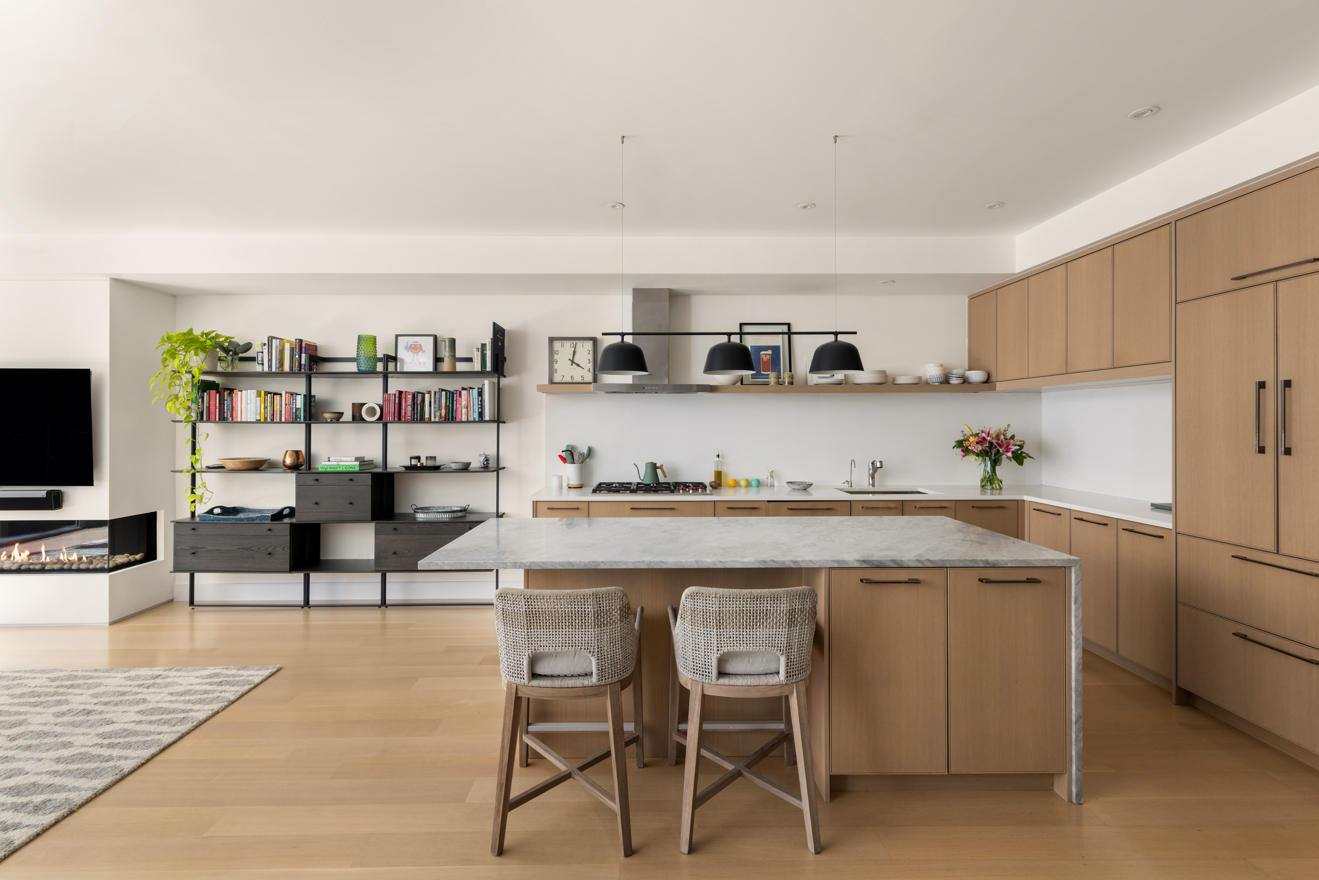 134 West 83rd Street, Unit 4 Manhattan, NY 10024 - Photo 7 of 17 a kitchen with stainless steel appliances granite countertop a table chairs sink and cabinets