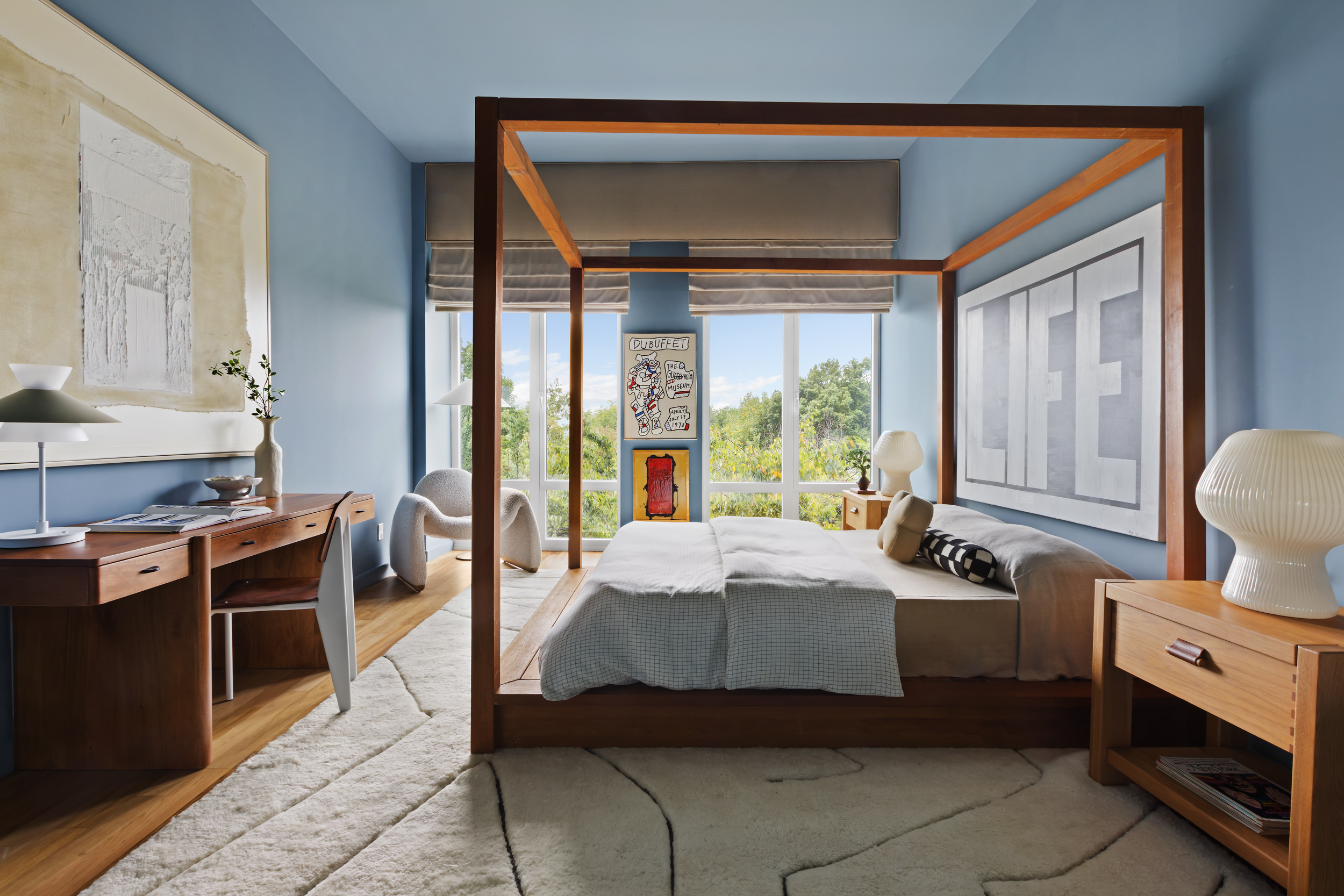 400 West 12th Street, Unit 4E Manhattan, NY 10014 - Photo 18 of 24 a bedroom with a bed and wooden floor