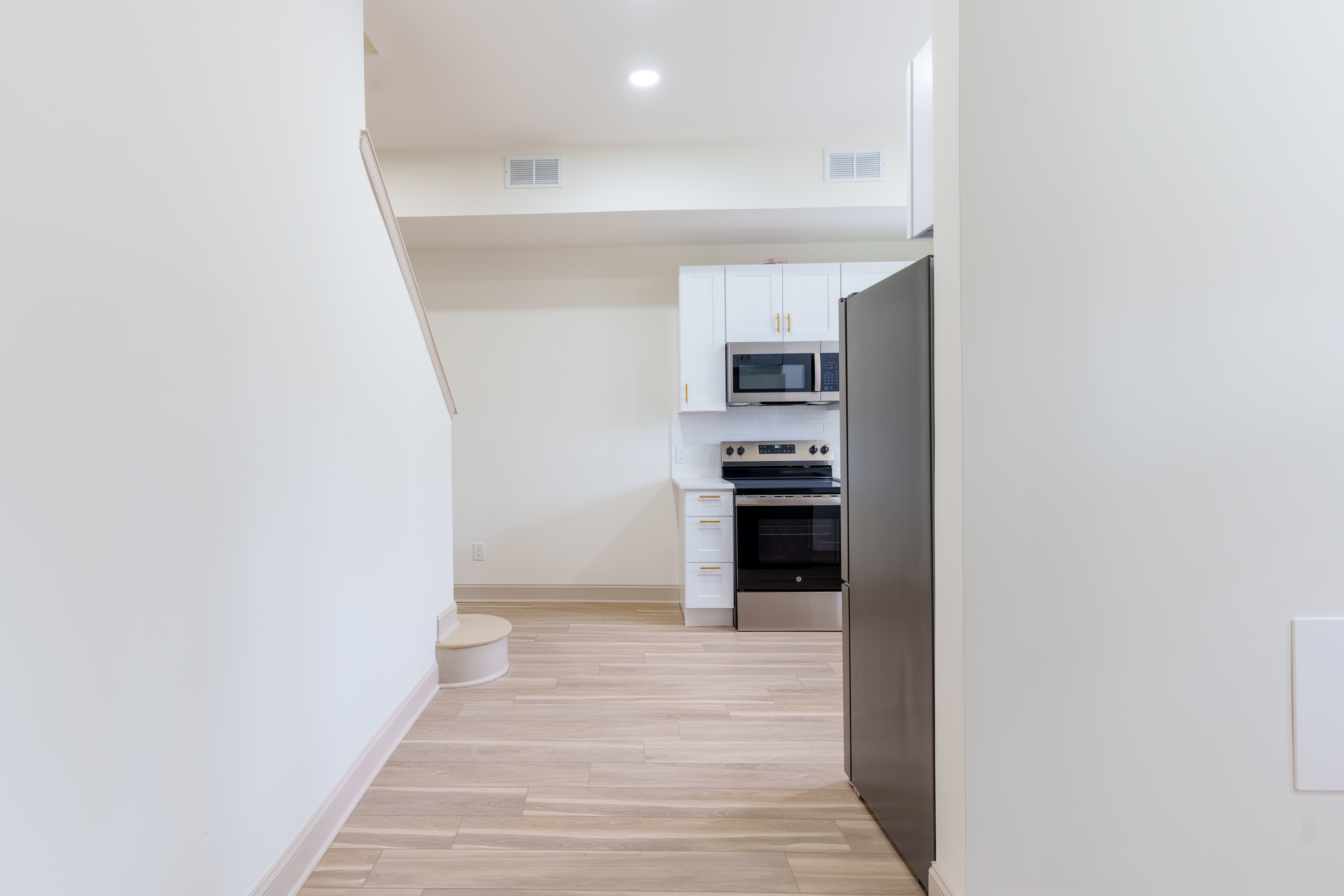 415 North Haddon Avenue Haddonfield, NJ 08033 - Photo 23 of 23 a kitchen with a refrigerator and a stove top oven