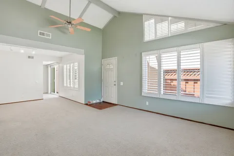 a view of an empty room with a window