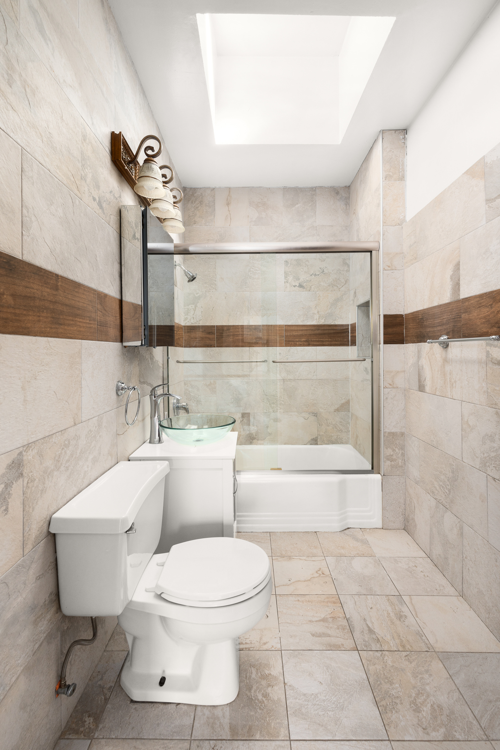 420 8th Street Brooklyn, NY 11215 - Photo 14 of 20 a bathroom with a toilet a sink and a shower