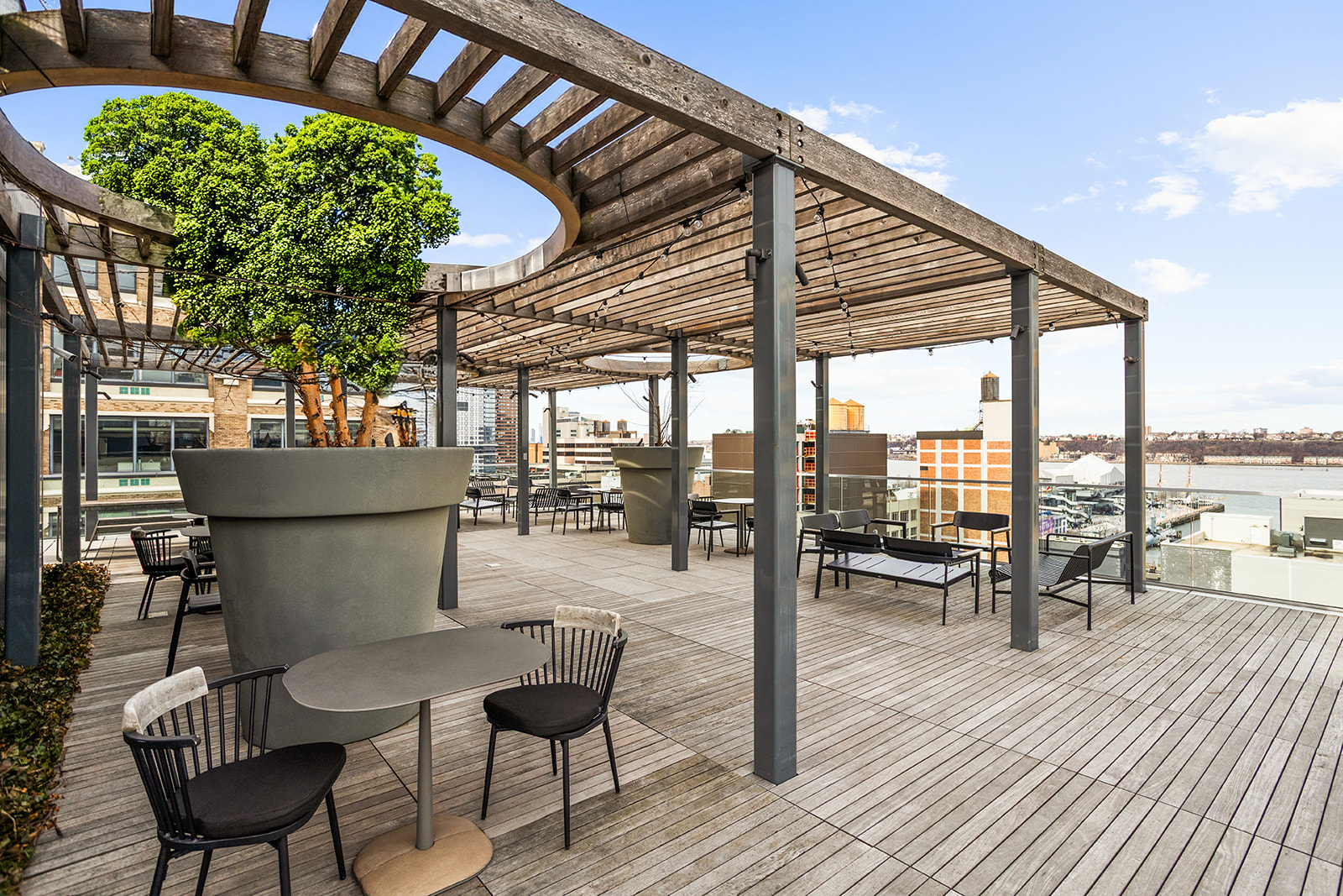 547 West 47th Street, Unit 1102 Manhattan, NY 10036 - Photo 9 of 19 a view of a chairs and table in the patio and a patio