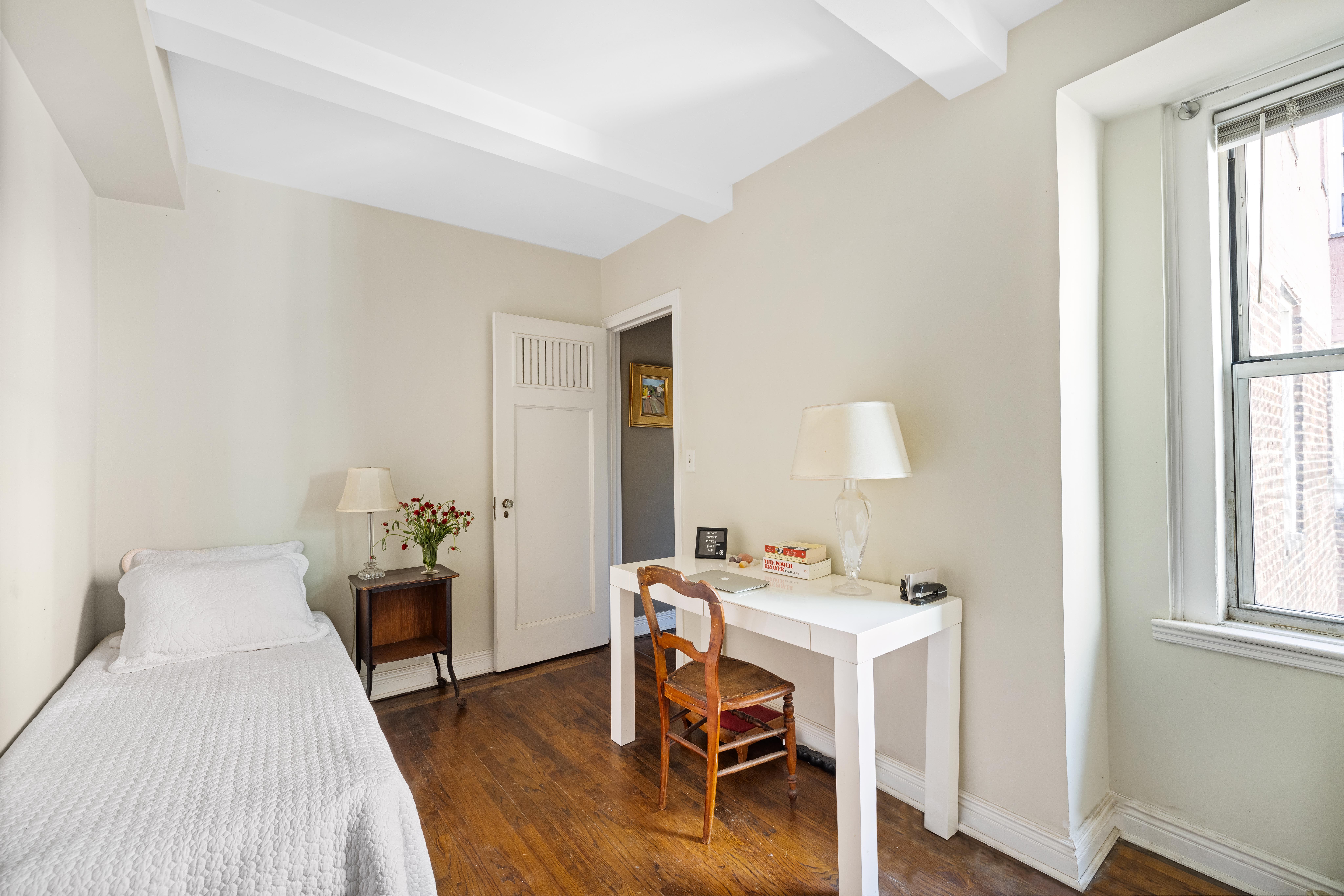 333 East 43rd Street, Unit 922 Manhattan, NY 10017 - Photo 10 of 14 a workspace with furniture and window