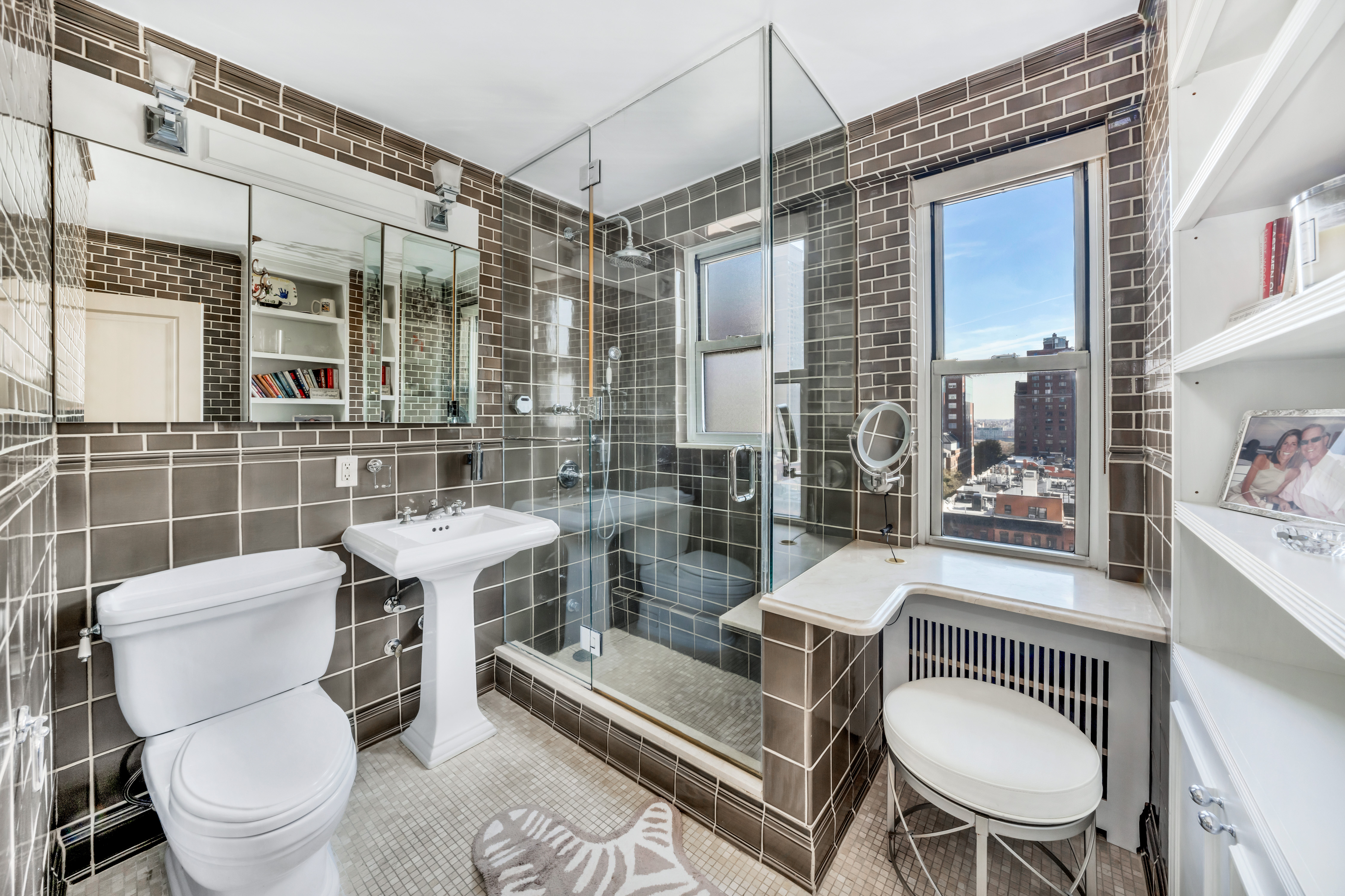444 East 84th Street, Unit PHE Manhattan, NY 10028 - Photo 7 of 12 a bathroom with a toilet a sink and a shower