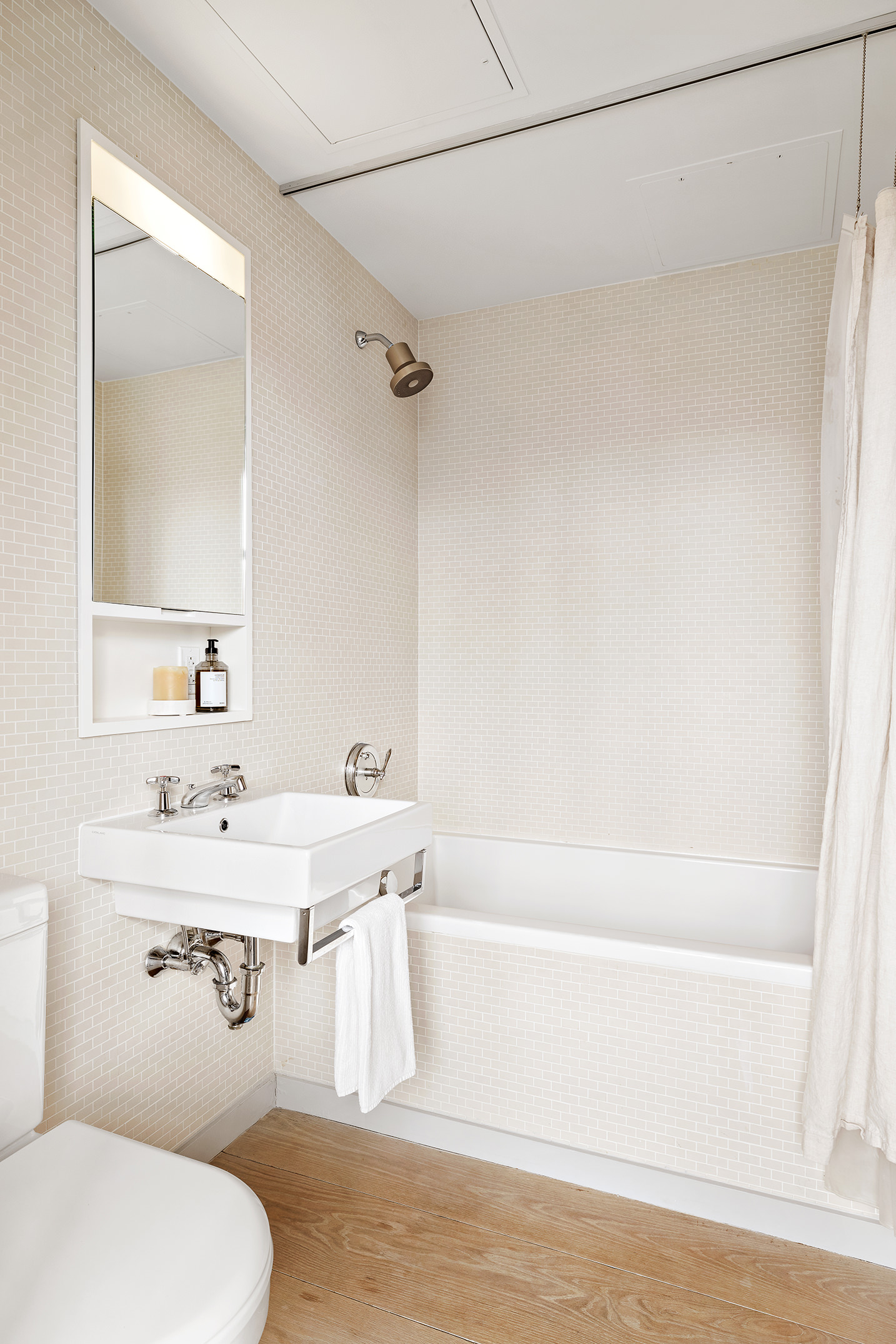 456 West 19th Street, Unit PHG Manhattan, NY 10011 - Photo 8 of 12 a bathroom with a sink toilet and shower
