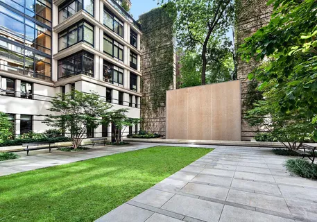 a building view with sitting space and garden view