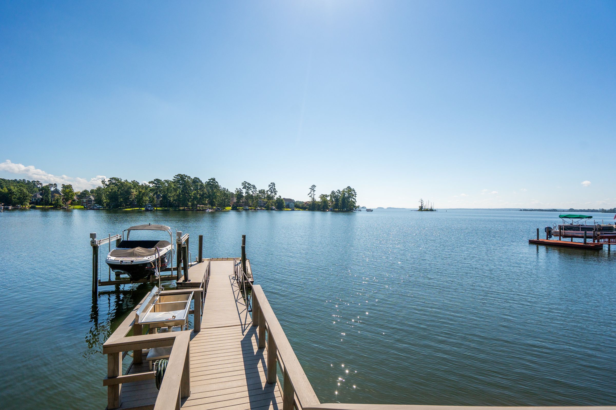 249 Pointe Overlook Drive Chapin, SC 29036 - Photo 52 of 56 a view of a lake with houses