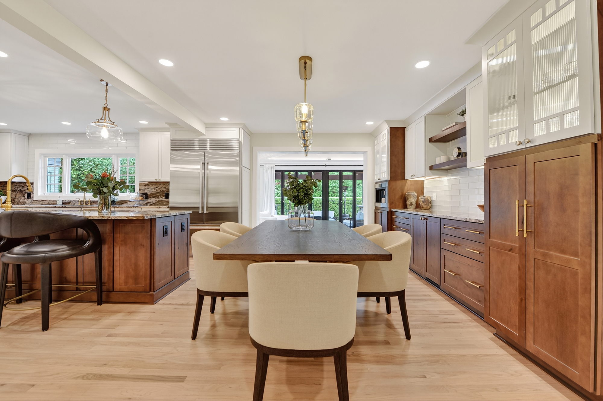 1205 Beaver Road Sewickley, PA 15143 - Photo 32 of 94 a kitchen with kitchen island a dining table chairs stainless steel appliances and cabinets