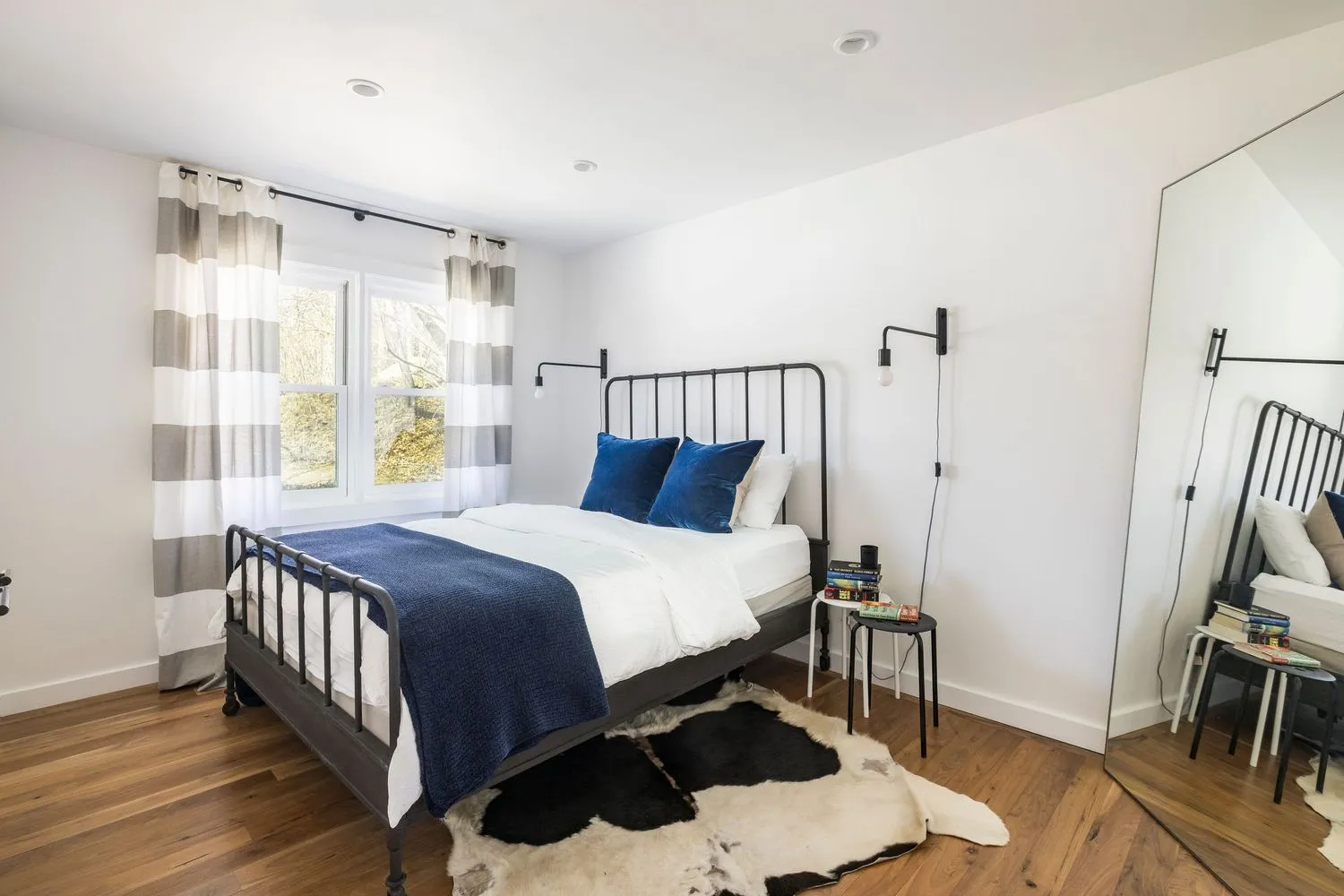 a bedroom with a bed and a table in it