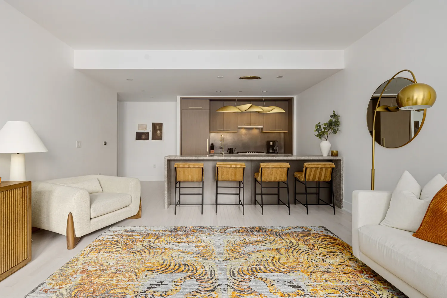 a living room with furniture and a rug