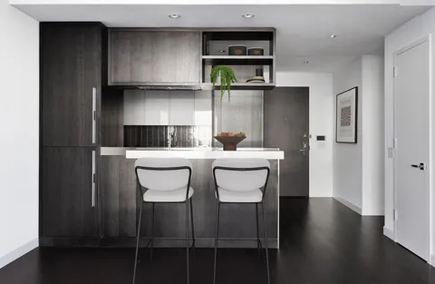 a kitchen with a sink and cabinets
