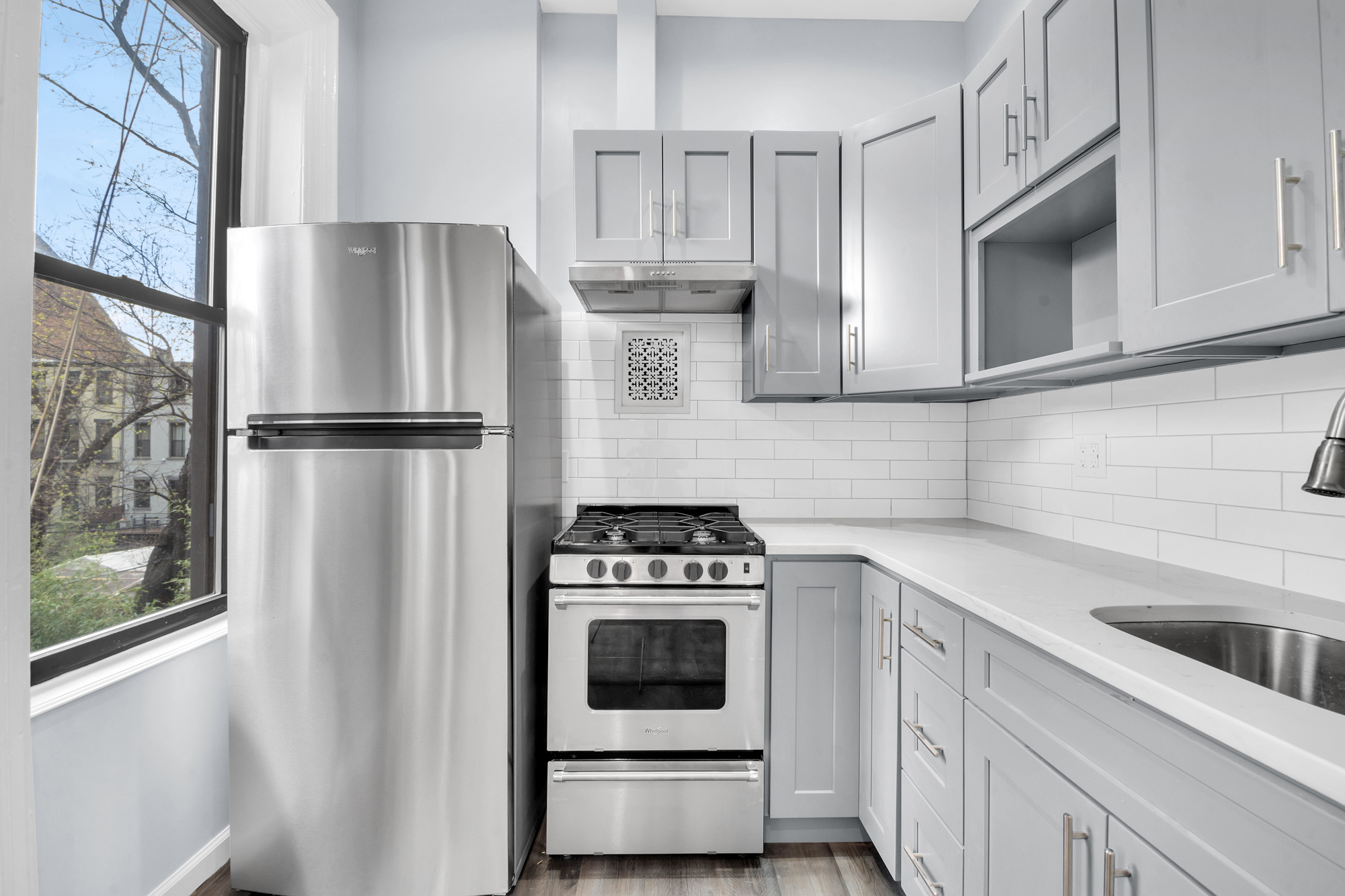 316 Lewis Avenue, Unit 2 Brooklyn, NY 11221 - Photo 2 of 8 a kitchen with cabinets and steel stainless steel appliances