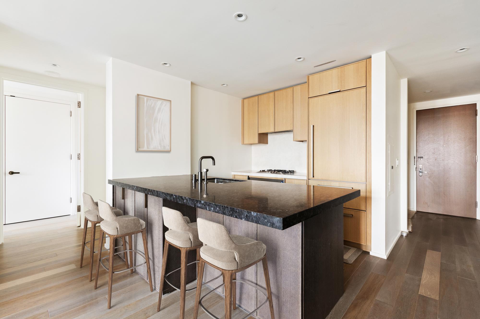 543 West 122nd Street, Unit 6B Manhattan, NY 10027 - Photo 3 of 17 a kitchen with a sink cabinets and wooden floor