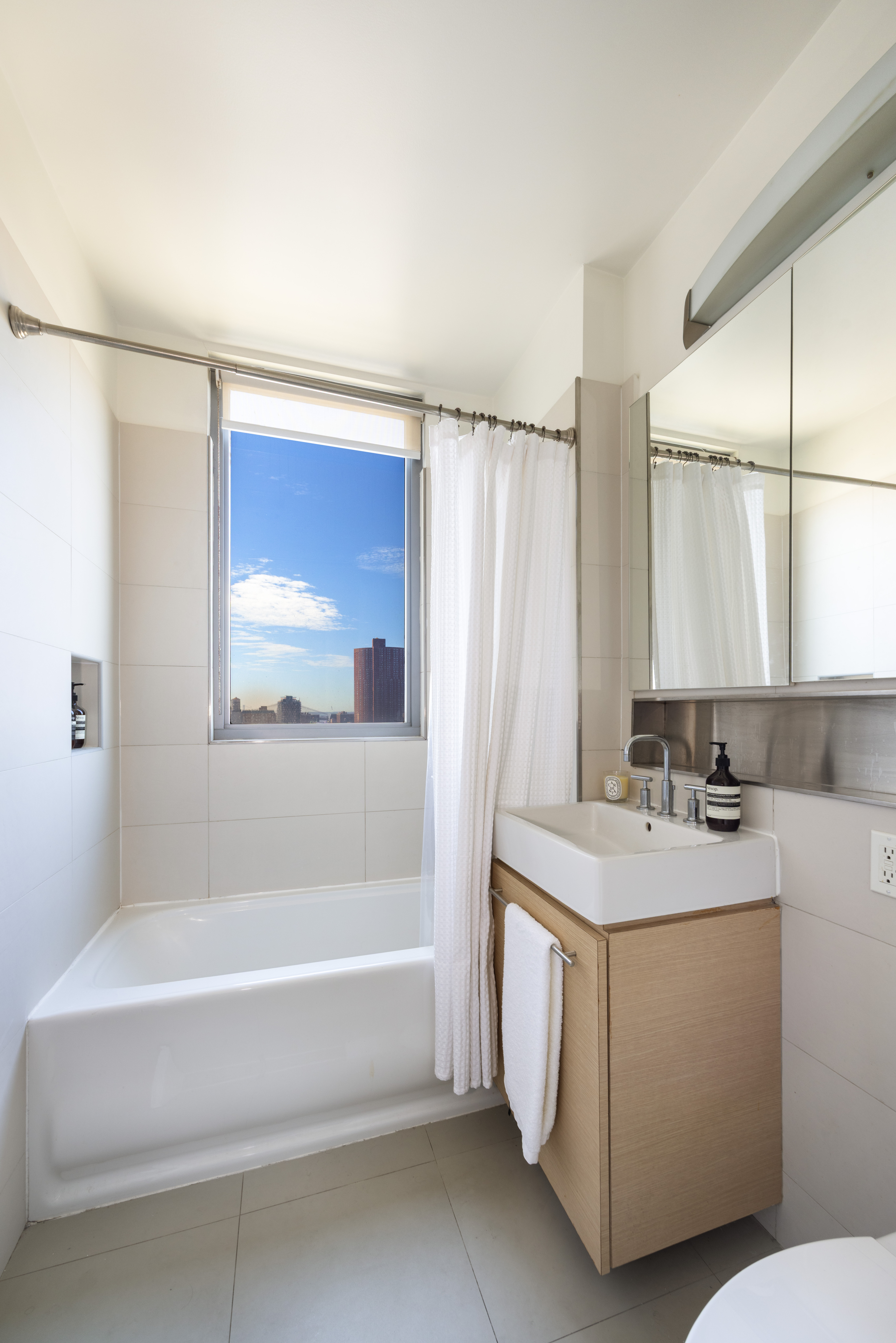 38 Delancey Street Manhattan, NY 10002 - Photo 5 of 11 a bathroom with a sink and a bathtub