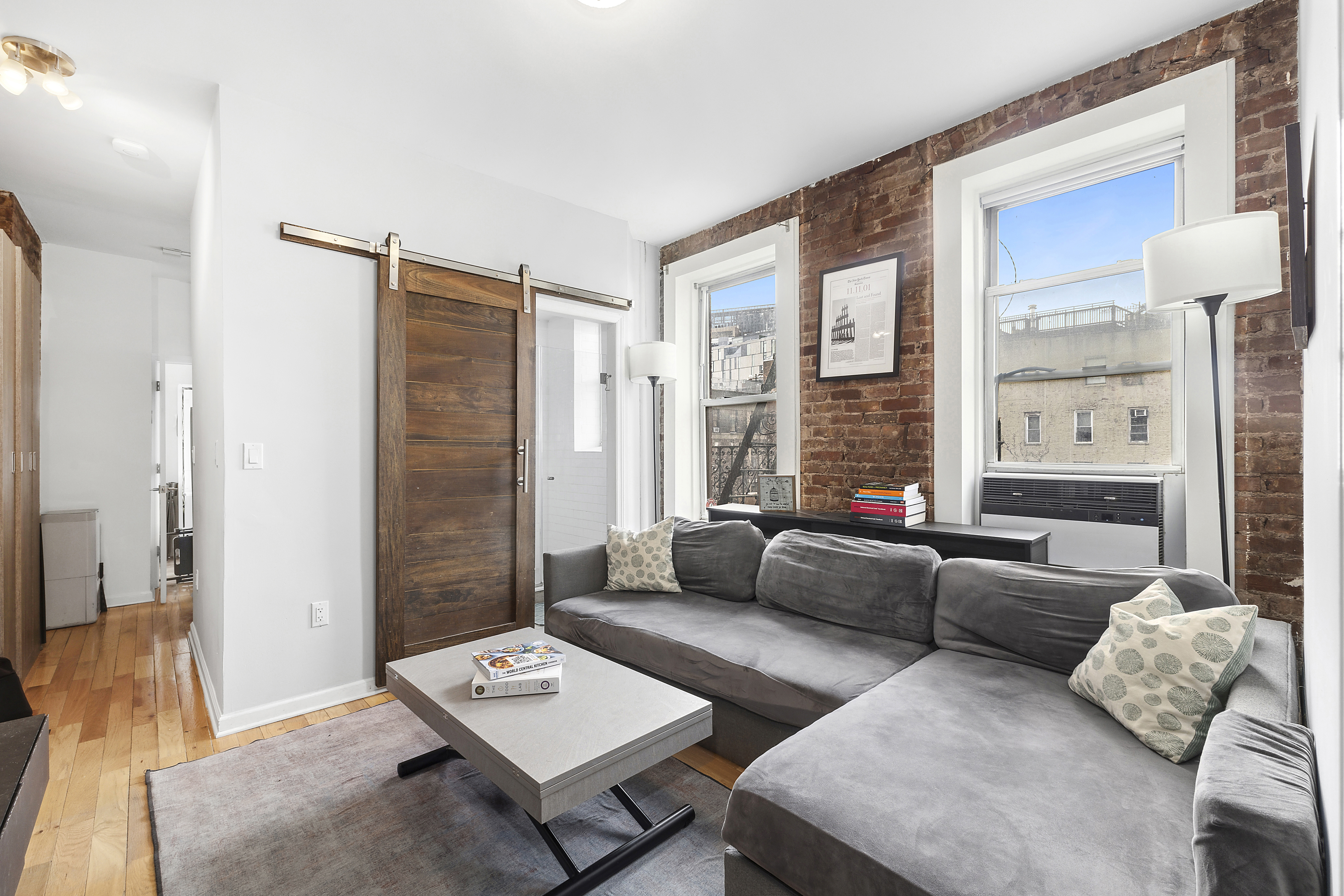 a living room with furniture and a window