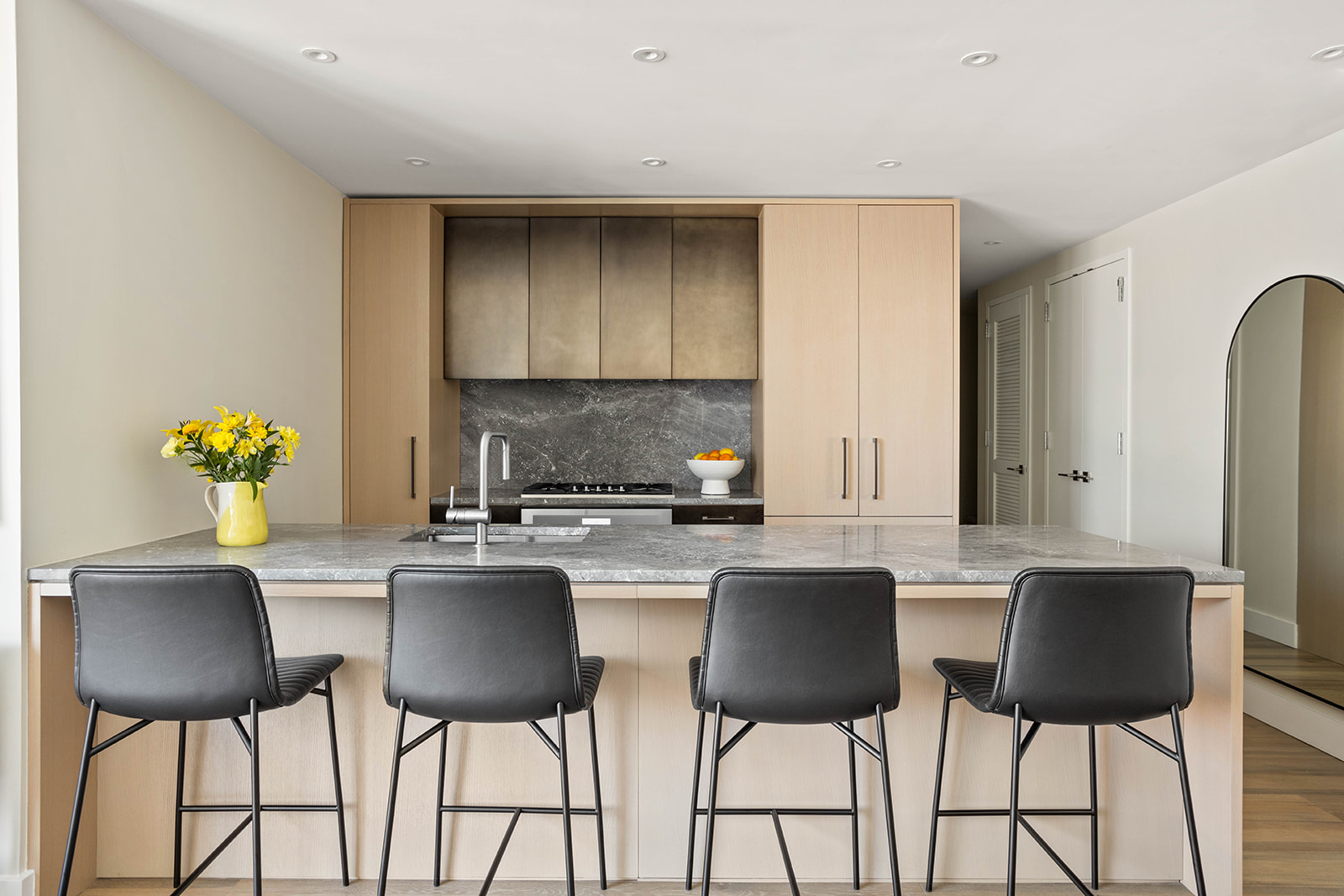 561 Pacific Street, Unit 606 Brooklyn, NY 11217 - Photo 3 of 17 a kitchen with stainless steel appliances granite countertop a table chairs and a refrigerator