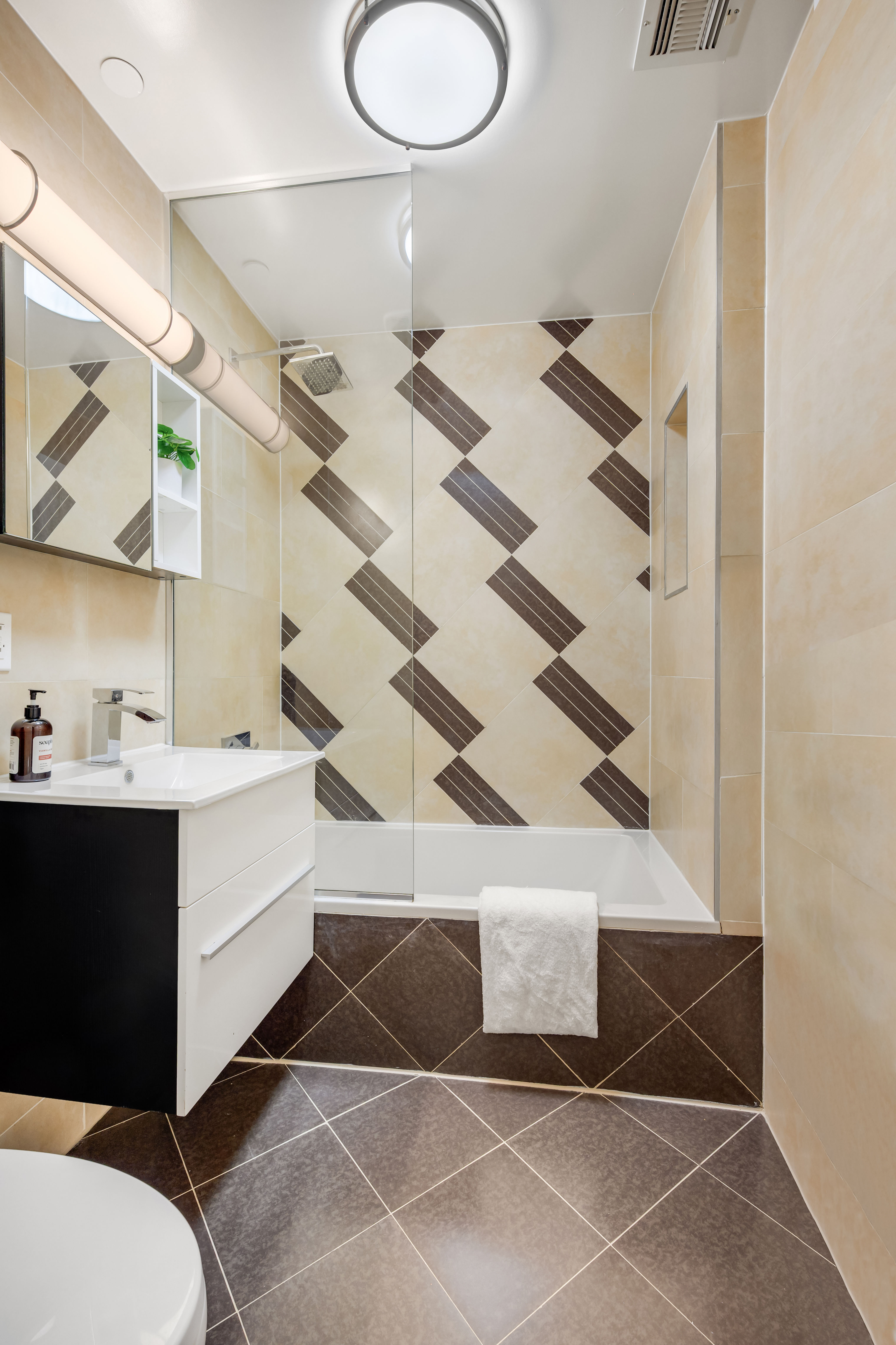 679 Quincy Street, Unit 2 Brooklyn, NY 11221 - Photo 7 of 9 a bathroom with a sink and a mirror