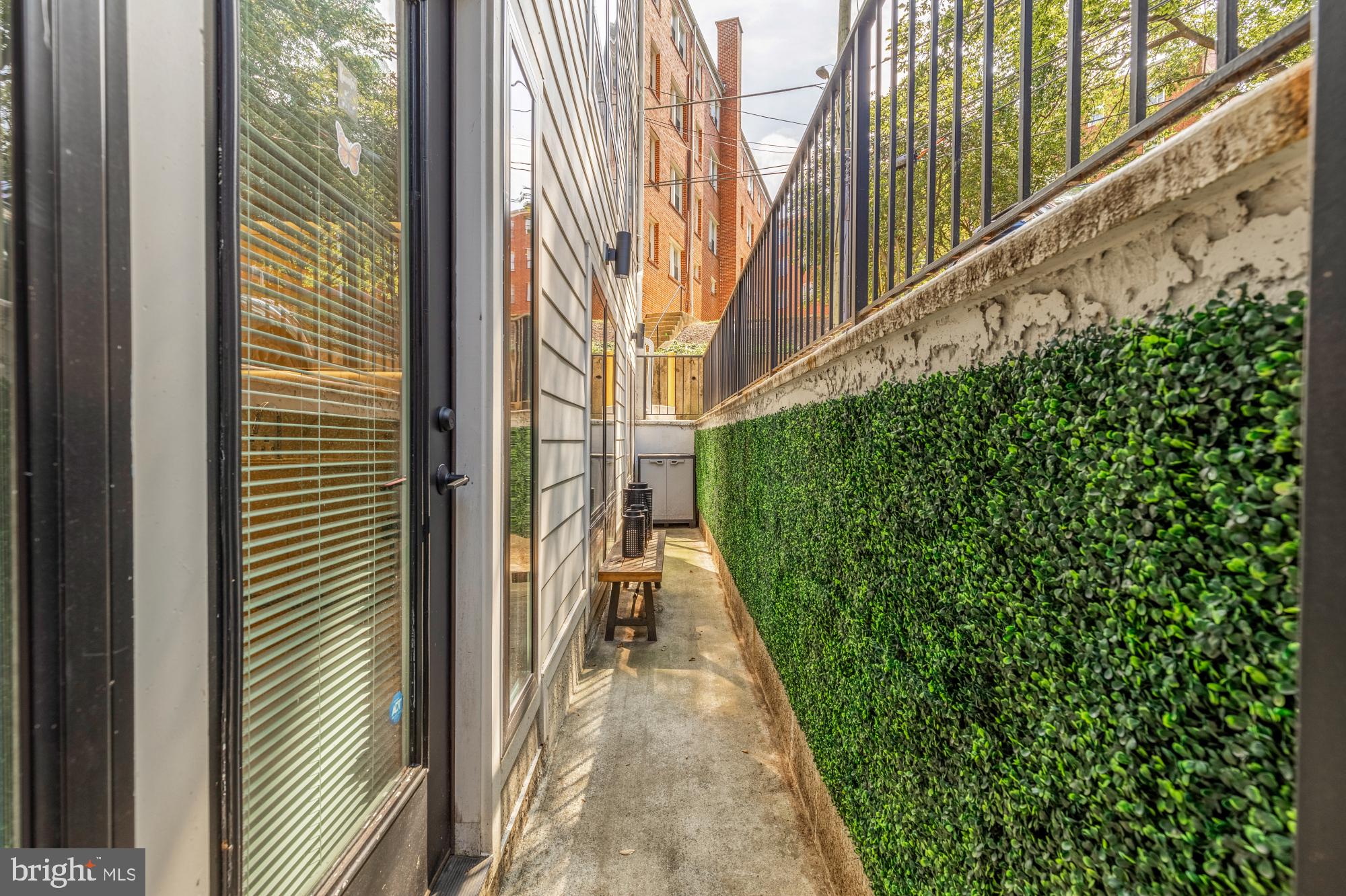 2630 39th Street Northwest, Unit 1 Washington, DC 20007 - Photo 14 of 26 a view of a pathway both side of house