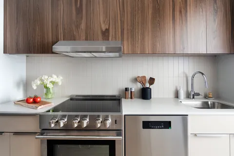 a kitchen with a stove and a cabinets