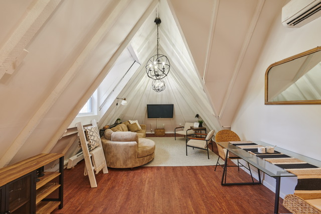 331 Highland Boulevard, Unit 2 Brooklyn, NY 11207 - Photo 2 of 6 a living room with furniture and a wooden floor