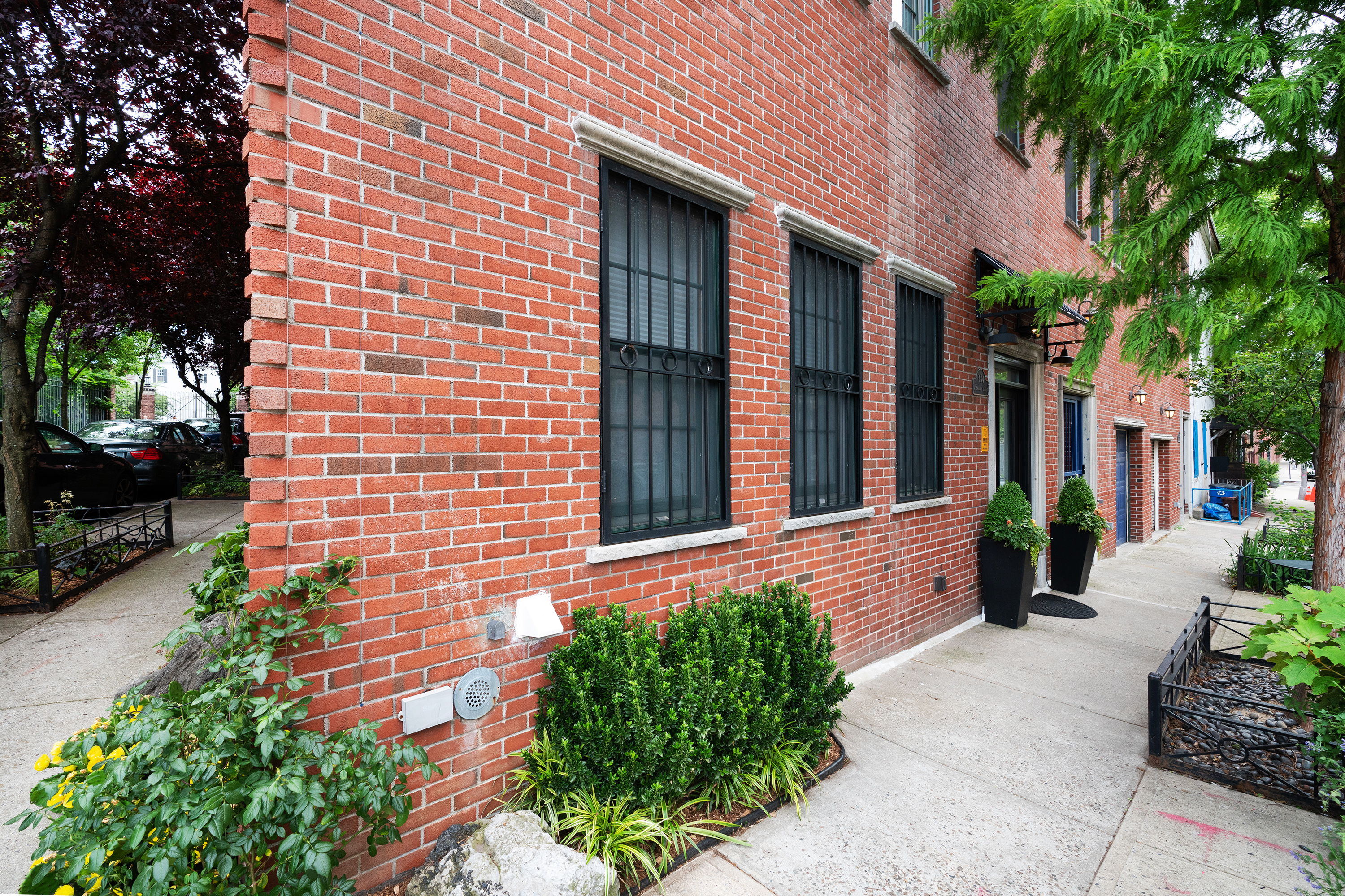 334 Plymouth Street Brooklyn, NY 11201 - Photo 30 of 32 a front view of a house with potted plants
