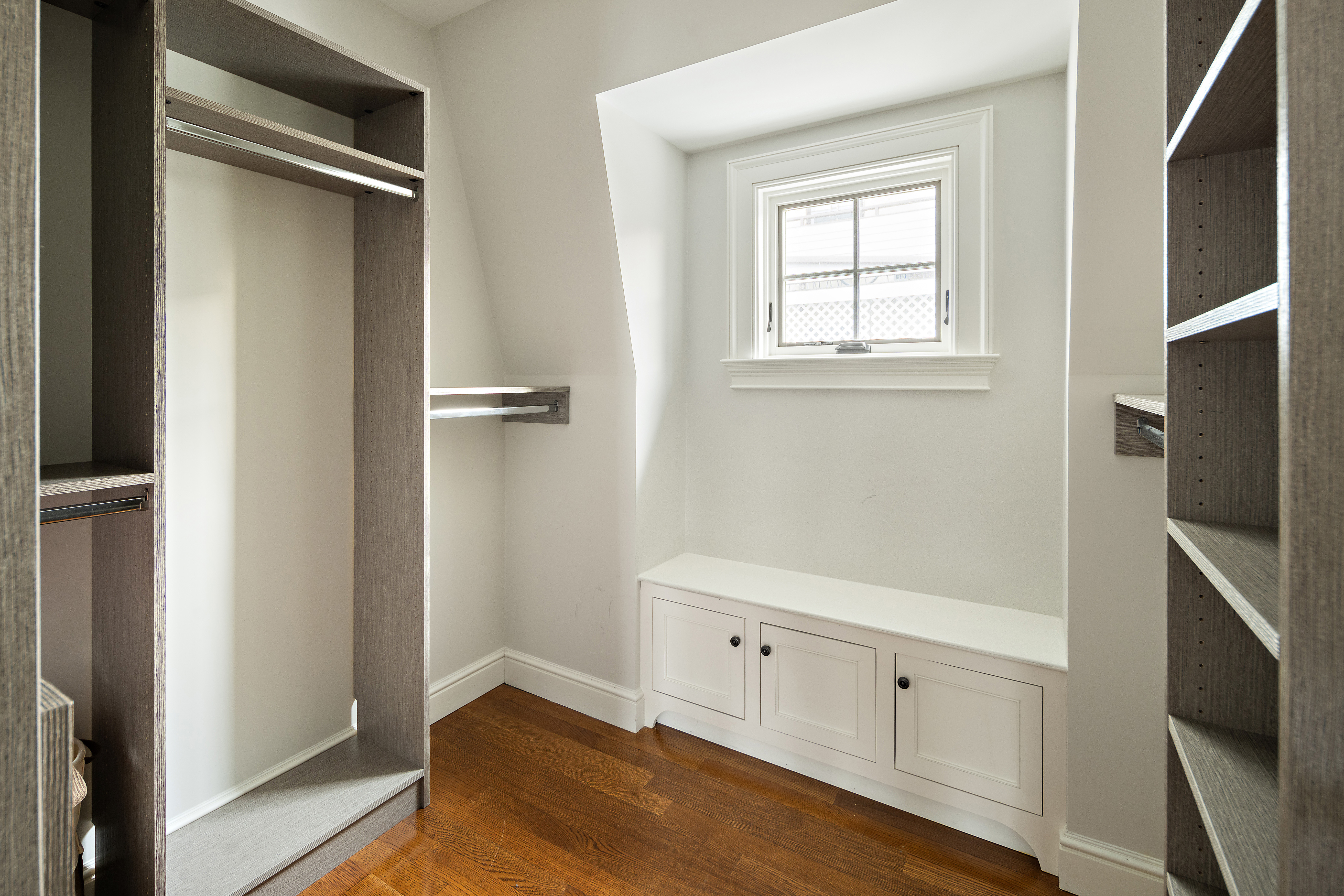 35 Willard Street Cambridge, MA 02138 - Photo 19 of 36 a view of an empty room with window and wooden floor