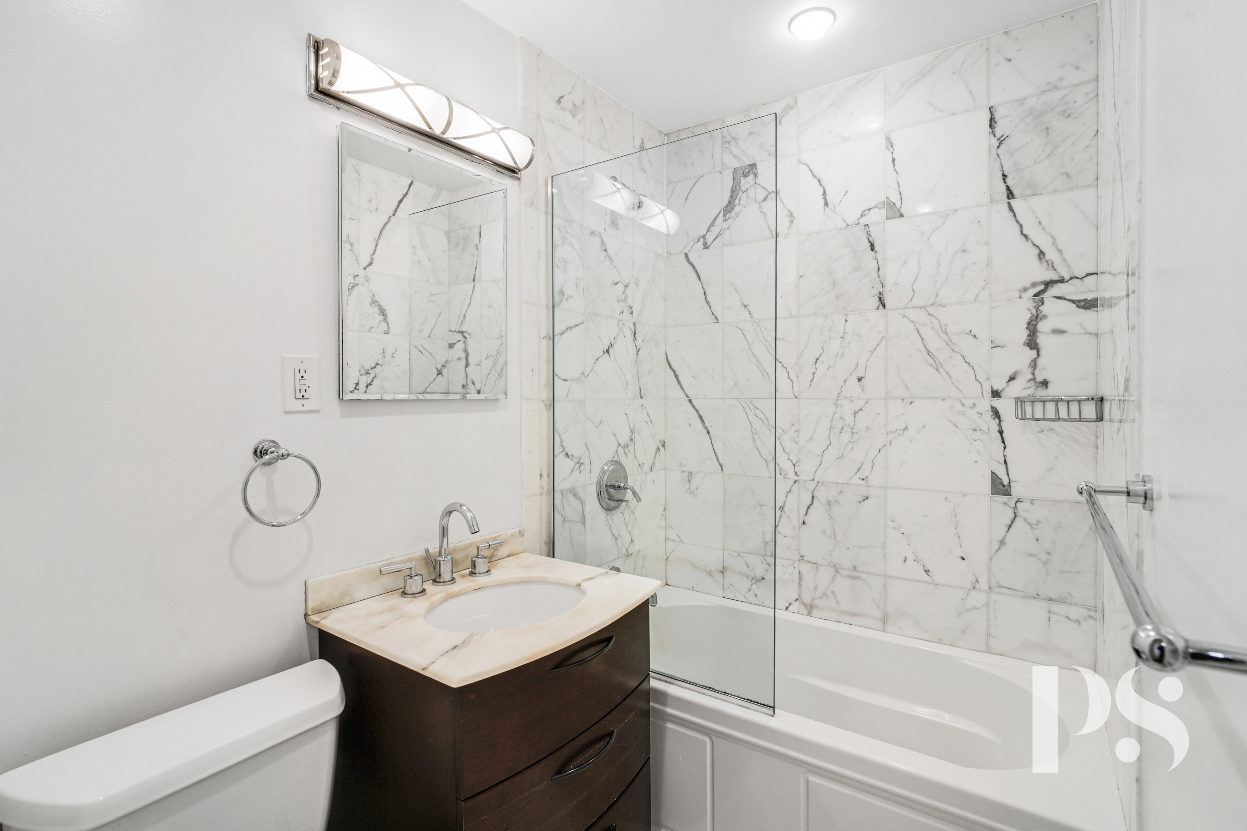 133 Barrow Street, Unit 1B Manhattan, NY 10014 - Photo 8 of 11 a bathroom with a sink toilet and shower