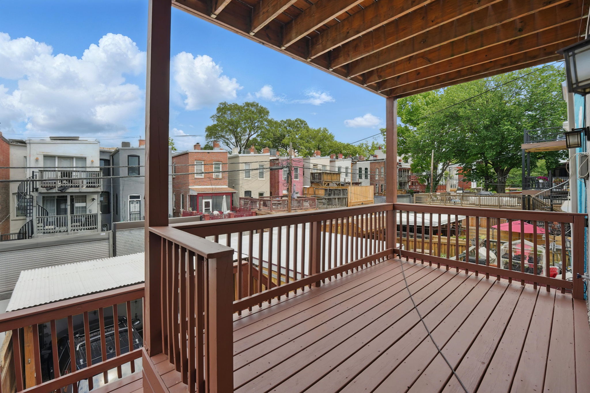 28 Q Street Northeast, Unit 2 Washington, DC 20002 - Photo 36 of 41 a view of a balcony with wooden floor