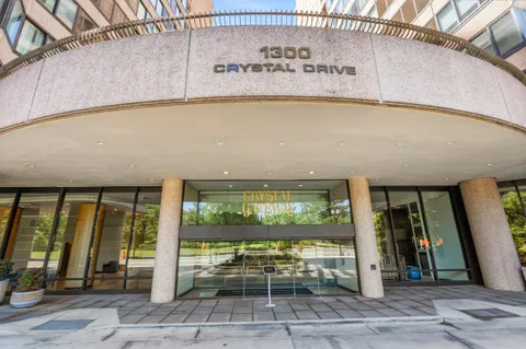 a outdoor view of a building with glass door and outdoor space