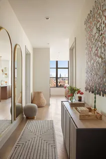 a spacious bathroom with a double vanity sink and a mirror