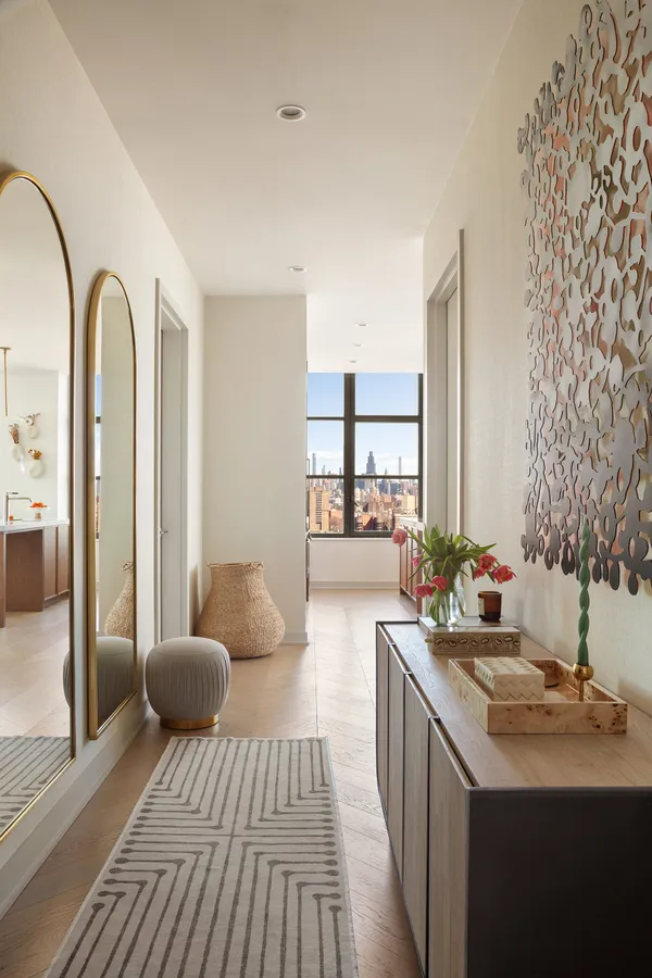 a spacious bathroom with a double vanity sink and a mirror