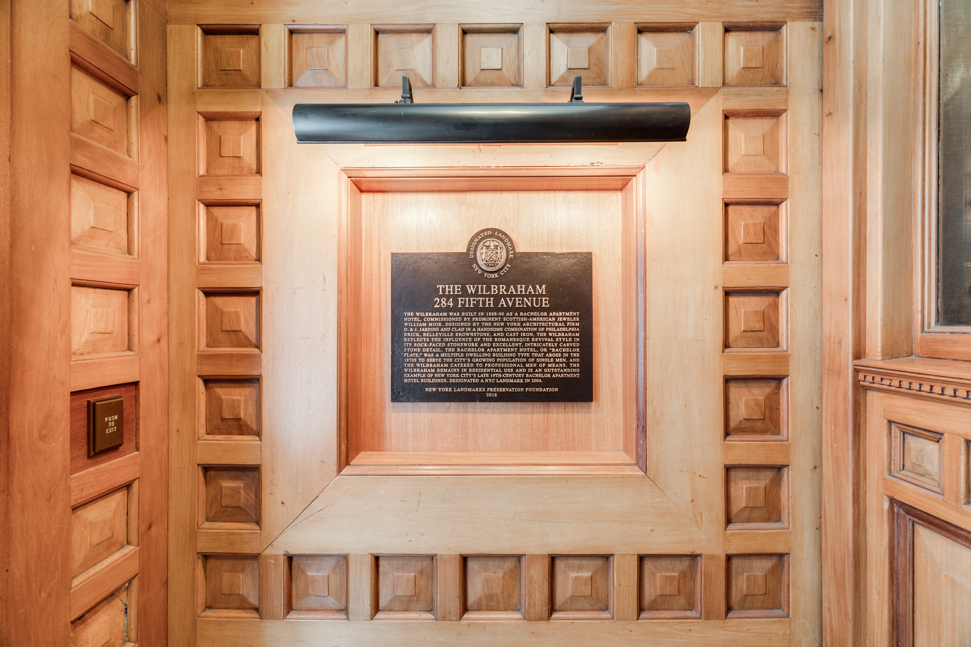 a front view of a building with a door and a window