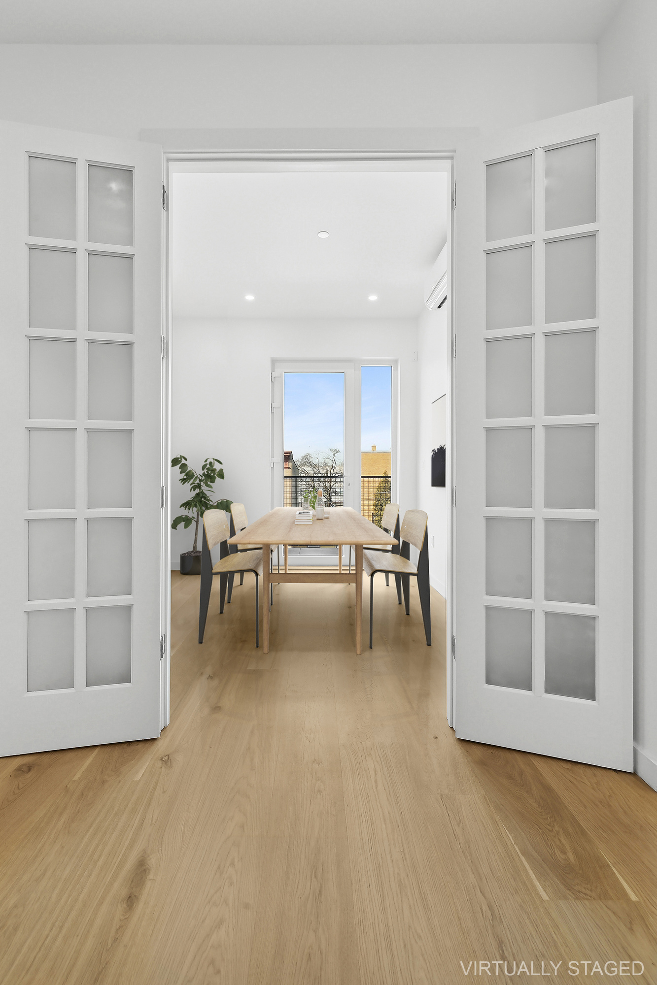 138 Schaefer Street, Unit 3A Brooklyn, NY 11207 - Photo 2 of 10 a living room with furniture and a large window