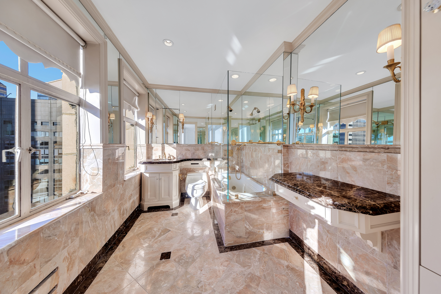 465 Park Avenue, Unit 34E Manhattan, NY 10022 - Photo 11 of 18 a kitchen with stainless steel appliances granite countertop a stove and a refrigerator