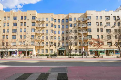 a view of a building with a street