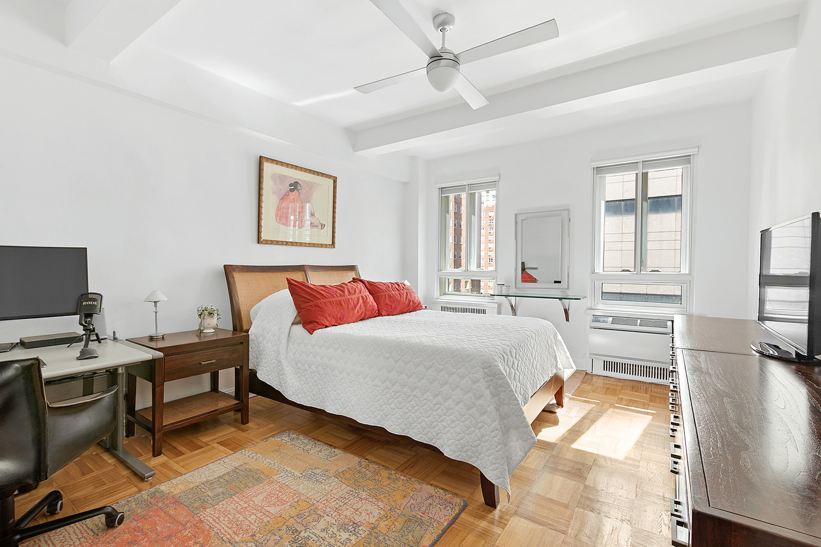 333 West 57th Street, Unit 8B Manhattan, NY 10019 - Photo 4 of 8 a bedroom with a bed and a window