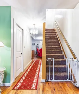 a view of entryway and hall with a rug