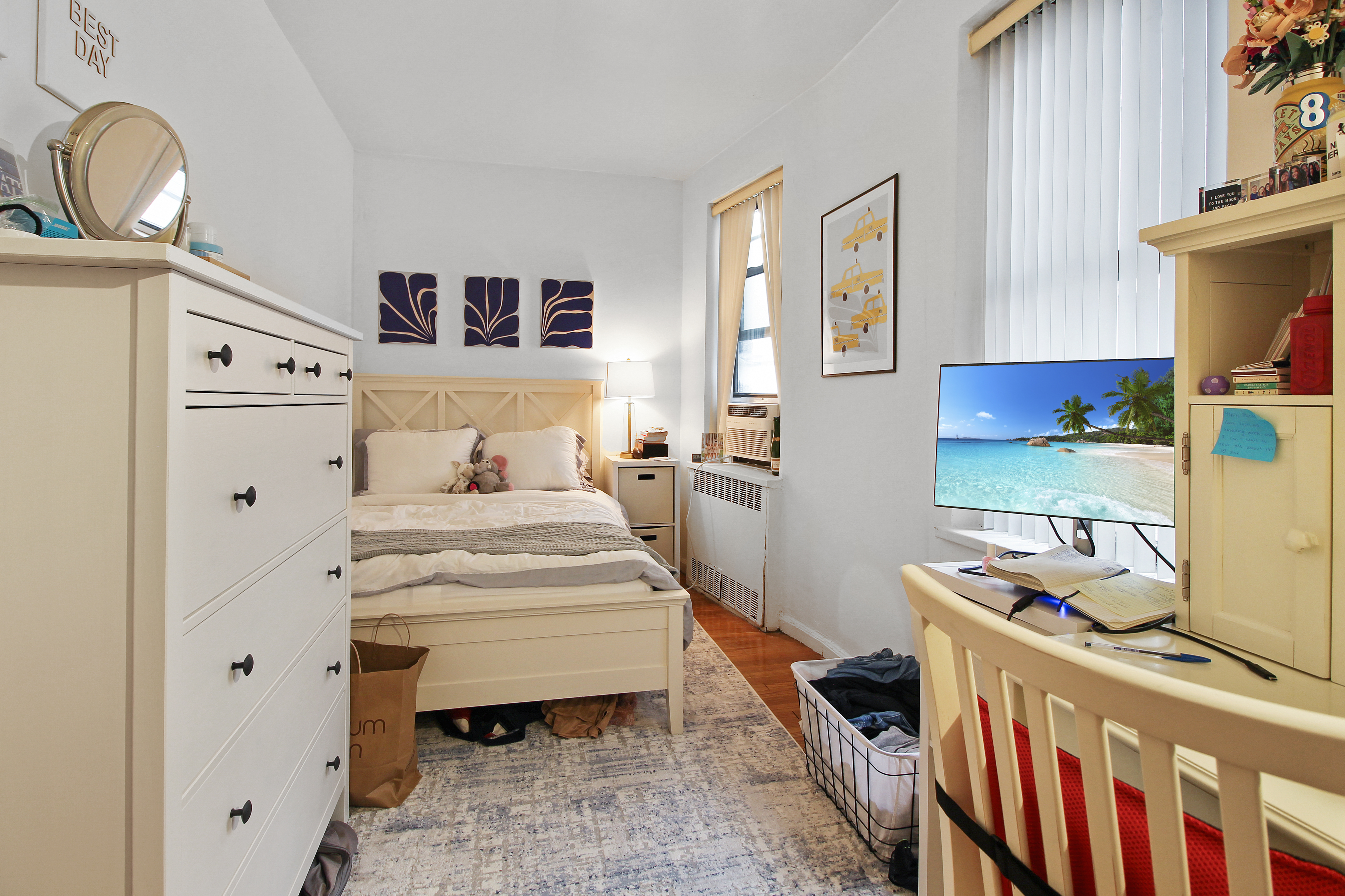 315 East 56th Street, Unit 5F Manhattan, NY 10022 - Photo 8 of 9 a bedroom with a bed and furniture