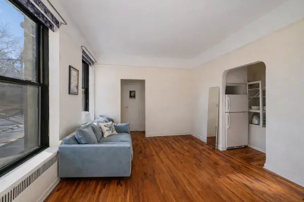 a living room with furniture and a window